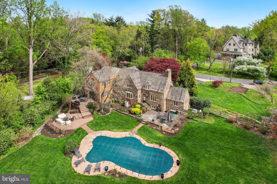 Nestled on a quiet cul-de-sac-like (practically Private) road in highly sought-after Meadowbrook, 1536 Warner Road is a striking stone Colonial that blends timeless stone architecture with thoughtful modern enhancements. With minimal traffic—thanks to its position near a private, colonial farm-style estate—this home offers rare serenity in a prime location.  

Make note, prior to starting your tour of this home, to take notice of the elegant lighting fixtures throughout every floor.  The main level welcomes with rich hardwood floors, sun-filled spaces and elegant flow. The chef’s kitchen features "best-of" appliances, stone countertops, and custom cabinetry.  Visitors should keep an eye out for charming, window-size stained glass panels that add mystery and character to perfectly sized rooms. The first floor also includes a den/study, well- suited for a home office, library, or quiet retreat. The front foyer-area on the ground floor includes a creatively remodeled powder room (that serves as an easy access bathroom for those enjoying outdoor activities).  Laundry facilities are very discreetly  and accessibly located on the ground floor.  A very welcoming  Family Room (with gas fireplace) invites comfort and relaxation, while inviting one to venture outside to enjoy the  bounty and beauty of the outdoors.


Upstairs, you'll find four generously sized bedrooms and an open hallway area that functions beautifully as a study, library nook, reading zone, small office—or even an accessory bedroom. There are three full bathrooms on the second floor, two of which have been fully renovated with high-end finishes. The (renovated) Master Bedroom Suite includes a "Juliet" balcony overlooking a Gatsby-like backyard—a sweeping view that evokes a storybook estate.

The finished lower level adds versatile living space, while housing a second refrigerator and a second double -oven - - especially handy for entertainment overflow.  This is an ideal indoor area for  a play center, "game-watch"  huddle area, hobby resource room, or place to hide from the "main-level" activity.  Two built-in cedar closets provide additional storage space.  The well-stationed windows permit  generous sunlight on this level.

Outdoors, expansive rear decks, lounging areas, “secret-village-like" pathways, and a restored concrete/gunite pool that is fit for movie-staging, provide a private, country-club like panorama for celebrations, as well as for completely private, quiet enjoyment - 1.27 acres to call your own.
There is a very large, S-shaped driveway (abundant off-street parking) and a comprehensive landscape that is  established, and which has been meticulously maintained.

Once you have viewed the pictures for this listing, make your appointment to see this unique property. 
 As beautiful as the pictures are, they understate the warmth, comfort, beauty and allure of this home.