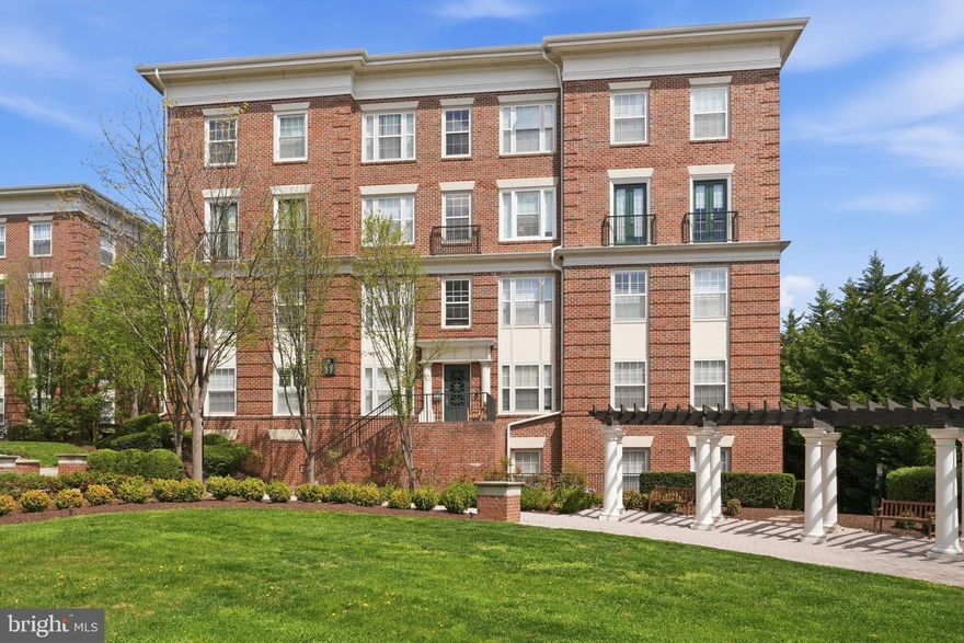 Welcome to 31 Booth St #450 in The Colonnades at the Kentlands — a light-filled, top-floor corner unit offering space, comfort, and an exceptional lifestyle in one of Montgomery County’s most sought-after communities.

This well-maintained 3BR/2BA condo features an open layout with hardwood floors, abundant natural light, and  fireplace. The kitchen includes granite countertops, stainless steel appliances, and a walk-in pantry, seamlessly connecting to the living and dining areas and out to a huge private balcony — perfect for relaxing, entertaining, or enjoying peaceful views.

The primary suite offers balcony access, a large walk-in closet, and an en-suite bath with dual vanities. Two additional bedrooms, another full bath, and in-unit laundry provide flexibility and convenience. Additional highlights include garage parking on the same level and extra storage in a dedicated storage room just outside the unit — both rare and highly desirable features.

Residents of The Colonnades enjoy resort-style amenities, including a pool, fitness center, library, and party room.

The Kentlands lifestyle truly sets this home apart — with easy access to parks, walking trails, scenic ponds, and open green spaces, all designed around a walkable, community-focused setting. You’re also just minutes from Great Seneca Highway, major commuter routes, and nearby biotech and life sciences hubs, making this an ideal location for both convenience and long-term value. Enjoy shopping, dining, and local favorites like Quincy’s Golf & Social right in the Kentlands.

A rare opportunity to own a top-floor corner unit that combines space, light, and an unbeatable location.

Open House Saturday 11-1pm!