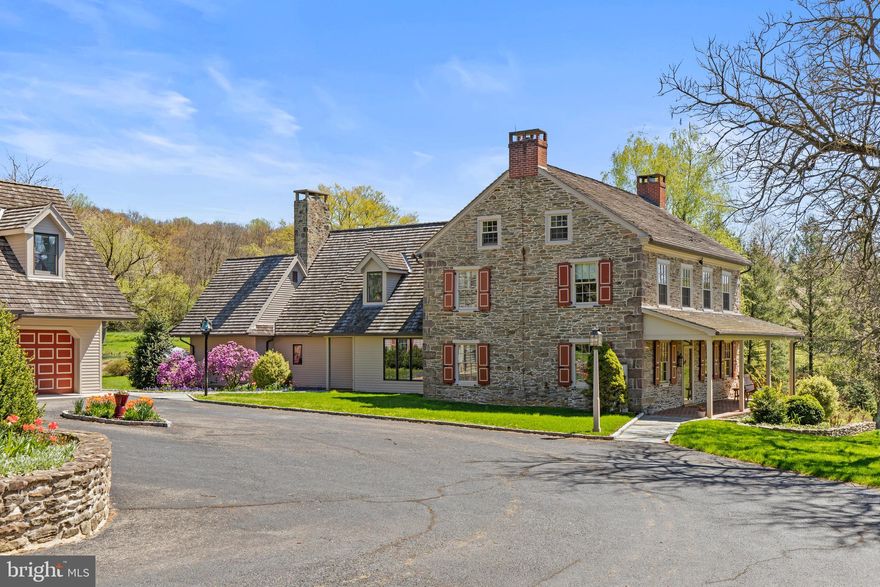 Welcome to this exquisite home located near the town of Lenhartsville. This historic property, dating back to the 1750s, exudes a unique blend of pre-revolutionary war charm and modern elegance. Situated on over 37 acres of land, this estate offers a serene escape with stunning views of the surrounding landscape. As you step inside, you are greeted by a spacious kitchen that is a chef's dream. Featuring granite countertops, Miele stainless steel appliances, and a tall beamed ceiling, this kitchen is not only functional but also a beautiful space. The kitchen stove top is induction, and oven has convection option making cooking your favorite meals a breeze. The open concept design seamlessly connects the kitchen to the family room, making it ideal for hosting and entertaining guests while enjoying the panoramic views. The hand-made wooden shutters are authentic reproductions of the colonial period, including the cast iron hardware and copper weather strips on top. The cedar shake roof was made to last up to 40 years. The primary bedroom is a luxurious retreat, complete with a cozy sitting area with wood fireplace, a walk-in closet, and a spa-like bathroom equipped with infrared heat light and steam shower. From the primary bedroom, you can enjoy breathtaking views of the pond and the natural beauty that surrounds the property. Outside, a deck provides the perfect spot to relax and soak in the tranquil atmosphere. Bluestone and Belgian block paved walkways adorned the home, installed in 2022 and 2023. The property also features a large stone barn with original wood beams, wood storage, and three horse stalls, offering a glimpse into the property's rich history. For car enthusiasts, there are two detached garages that can accommodate up to five vehicles. The main garage has three heated garage spaces and includes a separate one-bedroom apartment on the upper level, complete with a full kitchen. This versatile space can be used as additional guest quarters, a game room, or for other creative possibilities. All crops in the 2024 growing season will be harvested and retained by the tenant. Conveniently located just 25 minutes from Allentown, this home offers a perfect blend of historic charm, modern amenities, and picturesque surroundings, making it a truly exceptional property to call home.