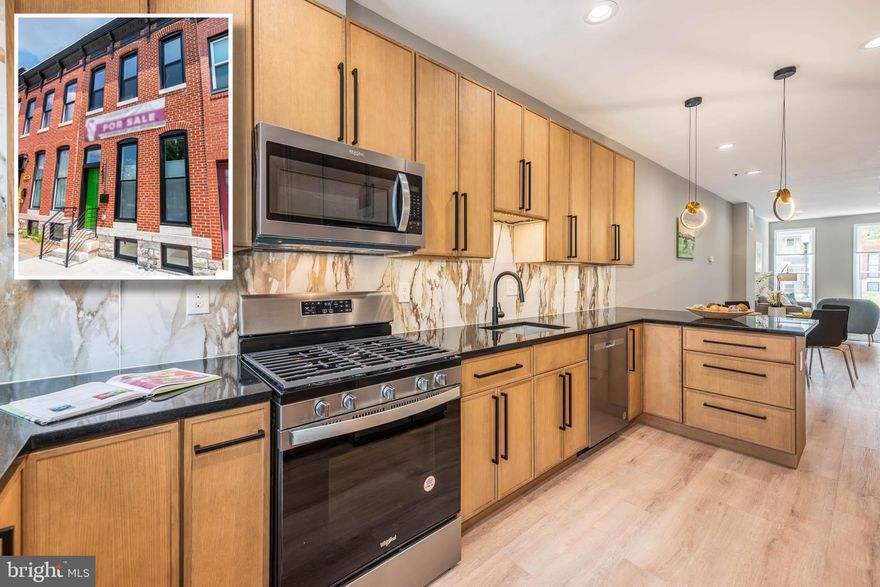 CUTTING EDGE NEWLY RENOVATED ROWHOME WITH 3 FINISHED LEVELS & OFF STREET PARKING!  Features include an inviting living room with exposed brick, a separate dining area, a designer kitchen with ample cabinet space, Quartz counters, & ss appliances, a convenient main level half bath, upper level Primary bedroom suite with a full bath, and a 2nd bedroom with a hall bath, a fully finished basement with a family room, 3rd bedroom, and 3rd full bath, and off street parking!  Eligible for 17K Live Near Your Work and 10K Vacants to Value Grants!