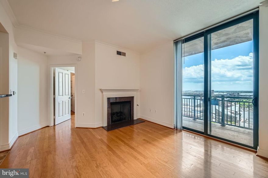 Welcome to SkySuite 2901 - A Spacious 2-Bedroom, 2-Bath Condominium with Stunning Water Views
Experience elevated living in this beautifully designed residence featuring soaring high ceilings and expansive water views. The open-concept layout enhances the sense of space and light, with floor-to-ceiling windows that flood the living area with natural light and offer breathtaking vistas of the Inner Harbor. The modern kitchen seamlessly connects to the living and dining spaces, perfect for entertaining or quiet relaxation. Relax in front of the elegant gas fireplace!  Both bedrooms are generously sized, with the primary bedroom offering a private en-suite bath and walk-in closet space. The second bedroom is ideal for guests, a home office, or family living. Additional features include in-unit laundry, premium finishes, and access to building amenities.  Your storage unit is conveniently located very close by and one parking space in secured garage conveys.  Full-service, secure, elevator building with 24-hour front desk and on-site management team.  
Whether you're enjoying a morning coffee on the balcony or taking in a sunset from the comfort of your living room, this condo offers the perfect blend of comfort, style, and location.