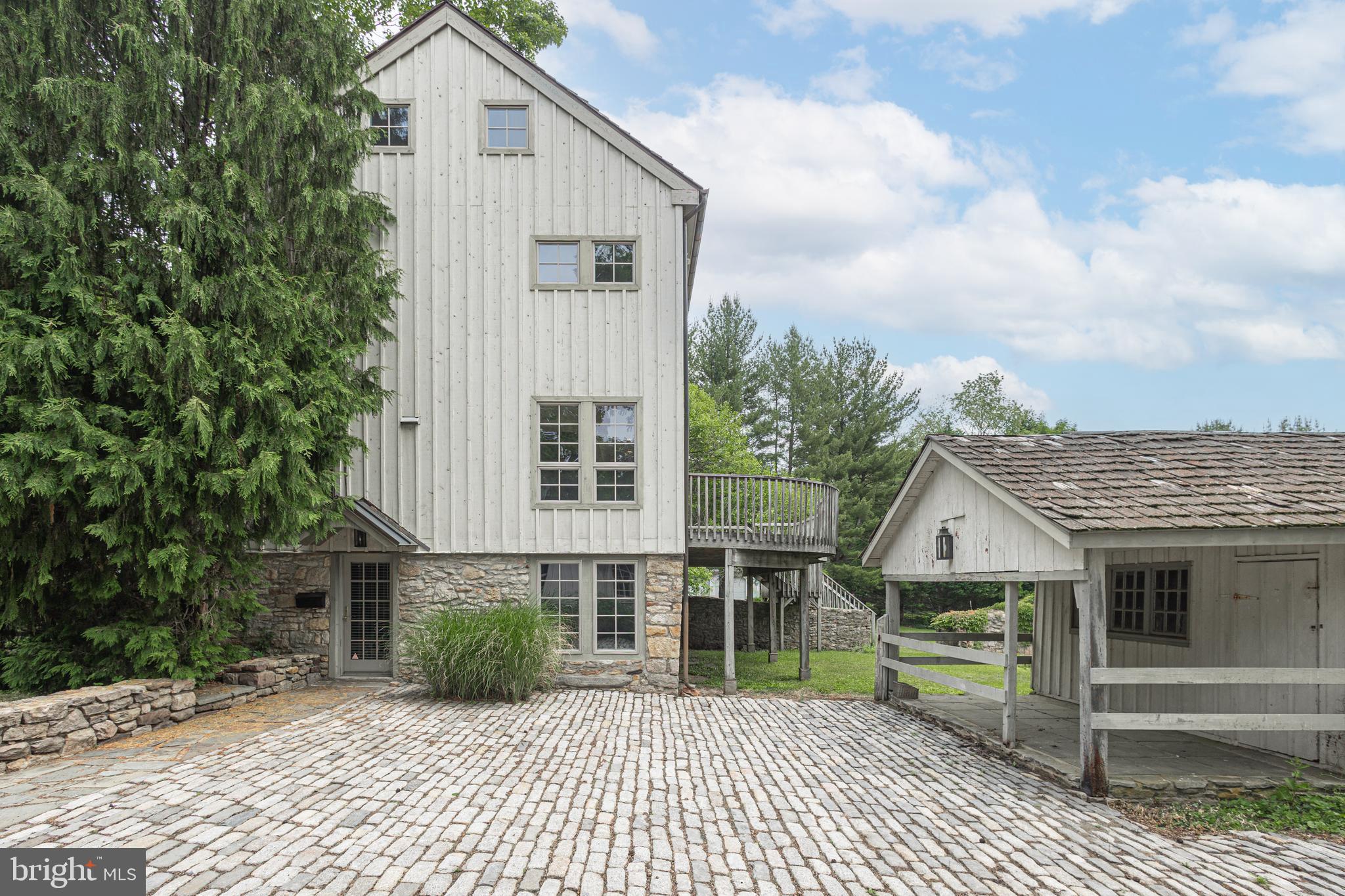 Nestled in a quiet community outside of New Hope and Doylestown, this delightful first floor, one bedroom apartment in Solebury Township is located in a converted barn. Brick flooring, stone walls, and exposed beams lend a unique charm. The galley kitchen offers an AGA stove, butcher block countertops and warm maple cabinets. The living room is accentuated with exposed beams, large windows and a barn stall room divider complementing the charming country setting. Updated full bath with tiled floors and tub shower provides access to the stackable washer and dryer. The bedroom with stone walls, antique brick flooring and large armoire is a scene out of Provence, France. Peaceful setting with views of gardens. Tenant responsible for electric, cable, and pest control. Heat, trash, and lawn maintenance included.