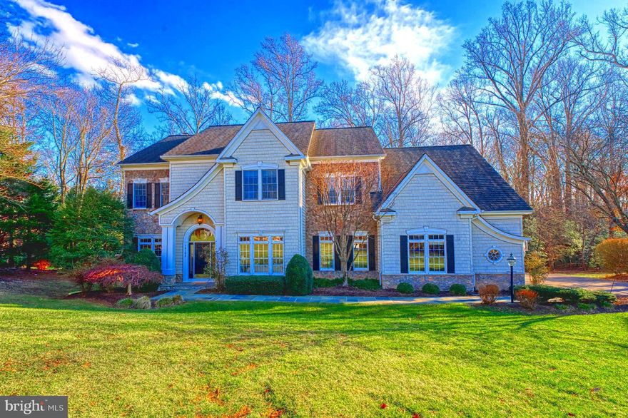FALL IN LOVE with this Grand Home on a Premium Lot!  In Oakton HS District. This custom-designed 6,800 sq. ft. home sits on a private  0.80-acre lot backing to a serene tree line, offering the perfect combination of luxury and functionality. With 6 bedrooms, 5.5 bathrooms, 3 car garage, this home is thoughtfully designed to provide space, style, and comfort.

The main level features a grand two-story foyer and 10-foot ceilings, creating an open and inviting atmosphere. The spacious living room flows seamlessly into the formal dining room, beautifully accented with stylish designer wall coverings and wood molding.  High quality cherry flooring is throughout most of the main level. The family room is a showstopper, with custom built-ins framing a stone hearth gas fireplace, coffered ceilings, and stunning views of the backyard, with direct access to the outdoor living spaces.

The gourmet kitchen, designed in crisp white with bold black accents, is the heart of the home. It features an large island with prep sink, oversized breakfast area with built-in cabinets and a beverage refrigerator, offering a perfect balance of beauty and practicality. Storage is abundant, with a walk-in pantry, a separate laundry room, and a generously sized mudroom with built-in organizers, all conveniently located just off the kitchen. A private library with glass French doors offers a quiet and elegant space for working from home.

Upstairs, you’ll find 5 large bedrooms with soaring 9-foot ceilings. The primary suite is a true retreat featuring a decorative coffered ceiling , complete with a sitting room, two walk-in closets, and a spa-like bathroom featuring dual vanities, a soaking tub, a glass-enclosed shower & separate commode room. Two additional bedrooms on this level include ensuite bathrooms and walk-in closets (for a total of 3 ensuite bedrooms), providing comfort and privacy for family or guests.  One of these large bedrooms could serve as a second primary suite there is extra storage in the eaves and an adorable children's den!

The lower level is light-filled and perfect for entertaining or relaxing, with large windows, a spacious recreation room, and custom-built media cabinets with kitchenette area with microwave and sink for snacks. This level also includes the 6th bedroom, a full bathroom, and a secure storage area accessible through the lower-level back entrance—ideal for recreation equipment, gardening tools, or additional storage. A large utility and storage room provide even more functionality. There is even a "zen den" for the kids under the stairs. 

The outdoor space is equally impressive, featuring a Trex deck that leads down to a stone patio creating a perfect spot for outdoor dining and relaxation. The backyard is beautifully designed for a potential pool, with the septic system thoughtfully placed in the front yard.  There is also a waterproof storage area under the deck for future pool equipment.

Situated in a prime location, this home offers easy access to Fairfax Corner, Fair Oaks Mall, and is less than 15 minutes from the Vienna Metro, Downtown Vienna, and Dulles Airport. This is a rare opportunity to own a home that combines luxurious living with convenience and practicality.  Located in the  sought after Dartmoor Woods neighborhood this home feeds to Waples Mill ES, Franklin Middle & Oakton HS.