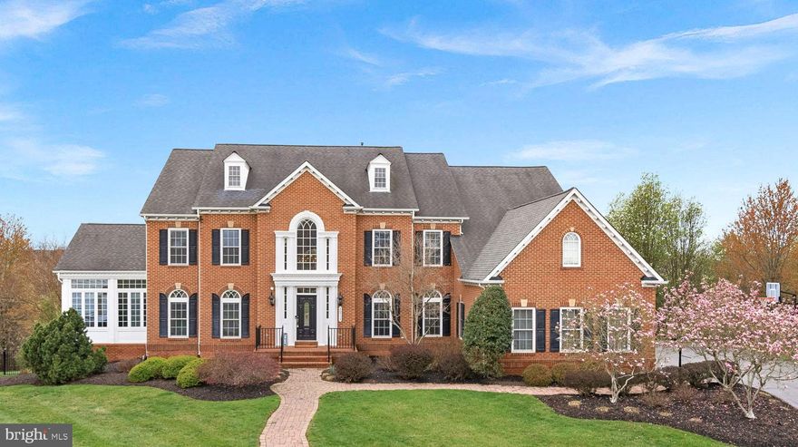 ** VA ASSUMABLE LOAN at 2.75%!!!  HUGE PRICE REDUCTION - DOWN another 100K!!  Welcome to this stately and impeccably maintained NVR Monticello model, boasting over 8,000 square feet of luxurious living space on a serene .53-acre lot. Located on a quiet cul-de-sac and backing to conservancy, this unique and rarely available property offers privacy and tranquility, all while being just minutes from Ashburn’s best amenities and...NO HOA! <br><br>

This exceptional home features an all-brick elevation, setting the tone for the sophistication that awaits inside. From the moment you step into the dramatic entrance, you’ll be greeted by a breathtaking double staircase, soaring ceilings, and elegant crown molding throughout. Designed for both entertaining and family living, the open and spacious floorplan includes formal LR and DR w/detailed finishes such as chair rail, coffered ceilings, and Brazilian Cherry hardwood floors.

The two-story family room is the perfect place to gather, w/a stunning gas fireplace framed by built-in shelving, providing both architectural interest and ample storage. Natural light pours into this space through beautiful grand wall of windows, complete with motorized shades. The adjoining gourmet kitchen is a chef’s dream, featuring upgraded cabinetry, a large island, granite countertops, stainless-steel appliances, a walk-in pantry and eat-in dining area. A bright and inviting morning room, overlooking the private backyard and pool area, is the ideal spot for a quiet morning coffee or relaxing with a good book.  This rear bump out has vaulted ceilings, a ceiling fan and breakfast bar adjacent to the kitchen.

Also on MAIN: a spacious office, a windowed conservatory framed by floor-to-ceiling windows on 3 of 4 walls, offering views of the lush landscape, a half bath, a large mud room & updated laundry room with cherry cabinets, quartz countertops, sink and GE Profile W/D.

Upstairs, the home offers four generous bedrooms, each with its own full bath. The luxurious owner’s suite includes a private sitting room, dual walk-in closets, and an opulent updated bath with soaking tub and stunning shower. Secondary bedrooms are equally spacious and filled with natural light, each with walk-in closets and en-suite baths.

The walkout basement, with a convenient side entrance, provides an abundance of living space for recreation and relaxation. Gather around the gas fireplace or enjoy the fully equipped wet bar, complete with a dishwasher, sink, fridge and microwave. A storage room off wet bar is perfect opportunity for a wine cellar! The incredible media/game room features a 10-foot diagonal fixed screen & A/V equipment and air hockey & foosball tables, billiards, and ping pong (all items convey). Don't miss the home gym with Jaccuzi brand stand-alone sauna (all items convey). The lower level also includes a fifth bedroom, perfect for a guest suite, office, or craft room, plus a full bath and large finished storage space.

The entire home has recently been freshly painted and new carpet installed, making it even more stunning!

Outside, the home is surrounded by  colorful perennial gardens and wooded conservancy. The fenced in backyard oasis includes a private pool with a tanning deck, complemented by spacious patio—ideal for entertaining or relaxing. Landscape lighting highlights the beauty of the property as you enjoy the quiet surroundings. Heated pool was completely retiled and replastered in 2024 w/new pump & filter, as well.

Additional highlights of this incredible home include a three-car side-entry garage with overhead storage, epoxied floor & Flow wall system throughout, a built-in basketball hoop, and a gas-powered 25 KW generator to ensure comfort during power outages.

Located just minutes from major commuter routes and the best shopping and dining in Ashburn, this home offers the perfect blend of privacy, luxury, and convenience. Don't miss this gorgeous UNICORN!