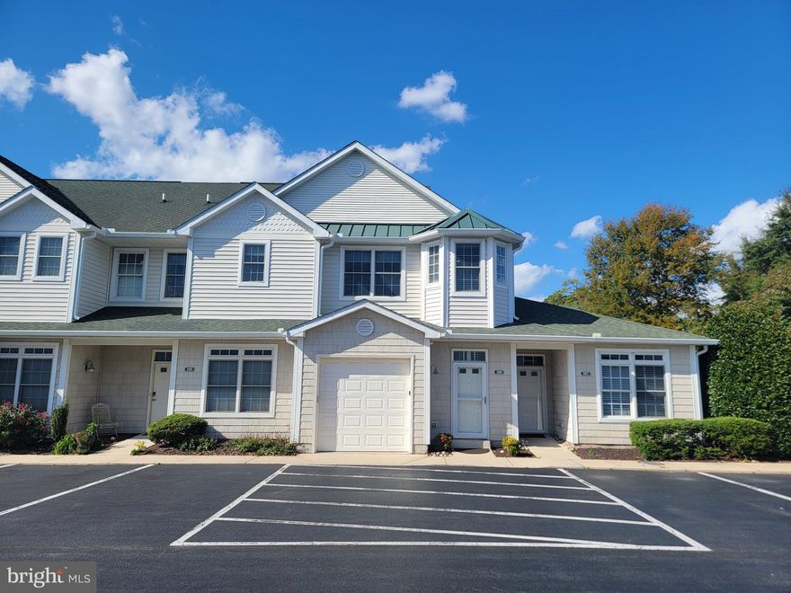 GREAT LOCATION EAST OF RT 1.   Welcome to  19967 Sandy Bottom  Circle #106 in Rehoboth Beach! This pristine, 3 bedroom 2 bath condo with garage is sure to impress.  Offered completely and beautifully furnished including artwork and ALL contents.  Perfect for your own retreat or for a rental investment.  1st floor garage with electric car charging station, laundry and entry hall, The 2nd level will delight as you view the large  great room area with cathedral ceiling and recessed lighting.   Warm hardwood floors invite you into the kitchen with maple cabinets, granite countertops and stainless steel appliances.  A breakfast bar with seating makes for quick dining or guest seating while your preparing snacks and dinner.  The owner's suite with walk in closet and private bath is situated separately from the other 2 bedrooms and bath.  Beautiful newly installed patterned carpeting welcomes you to the bedrooms and stairway.  All windows are fitted with tasteful motorized shades and are newly installed.  A new HVAC system was installed recently for many years of reliable heating and cooling.  Walk or bike to the beach and boardwalk and all of the amenities of beautiful downtown Rehoboth Beach.  Don't miss this rare opportunity.