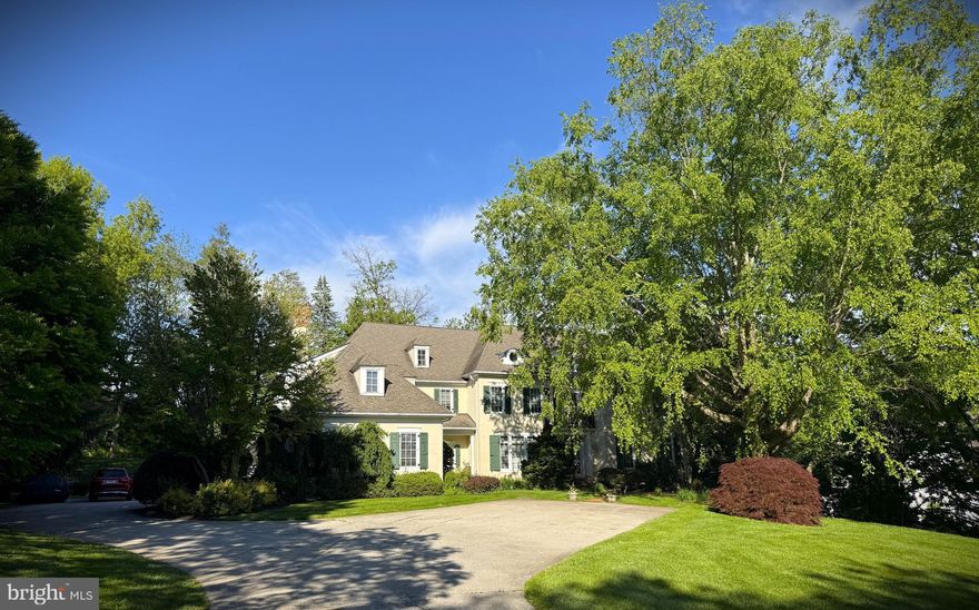 Nestled on a beautifully landscaped 0.79-acre lot in the sought-after Harriton Farms neighborhood of Villanova, this elegant center hall Colonial offers 5 bedrooms, 4 full bathrooms, and 2 half bathrooms with exceptional indoor and outdoor living spaces. A heated inground pebble pool with jacuzzi/hot tub and expansive flagstone patio create a private backyard retreat perfect for relaxing or entertaining while enjoying the serene surroundings. A grand entry with open staircase and large windows welcomes you into the home, where beautiful hardwood floors and exquisite architectural detailing flow throughout the first floor. The formal living room with crown molding and wood burning fireplace opens seamlessly to a richly appointed office/den with dark wood finishes.  The formal dining room with crown molding provides the ideal setting for hosting dinner parties both grand and intimate.  A charming Country Craft bar and service area connects the dining room to the spacious chef’s kitchen featuring Country Craft Cabinets, a large center island with gas cooktop, double wall ovens, stainless steel appliances, built-in desk area, and a sunny breakfast room overlooking the picturesque backyard. The kitchen flows effortlessly into the bright and inviting family room with a wood-burning fireplace, abundant natural light, and tranquil backyard views. Two convenient half bathrooms complete the main level, including one located off the mudroom with access to the impressive, built-in 4-car garage. The second floor features a luxurious primary bedroom suite with a fireplace, a separate sitting room, two walk-in closets, and a spacious en-suite bathroom with a soaking tub. A second bedroom offers private access to a full hall bathroom, while two additional bedrooms share a Jack and Jill bathroom. Convenient second-floor laundry.  Expansive flex space offering endless possibilities for a media room, fitness studio, playroom, or executive office completes this level. The finished lower level provides incredible versatility with a large recreation/playroom, additional bedroom, full bath, and outside entrance, making it ideal for an au pair suite, guest quarters, or extended family living. Located in the award-winning Lower Merion School District on a quiet cul-de-sac and just minutes from major roadways, shopping, dining, and Center City Philadelphia, this exceptional home combines timeless elegance with modern comfort in one of the Main Line’s most desirable neighborhoods.