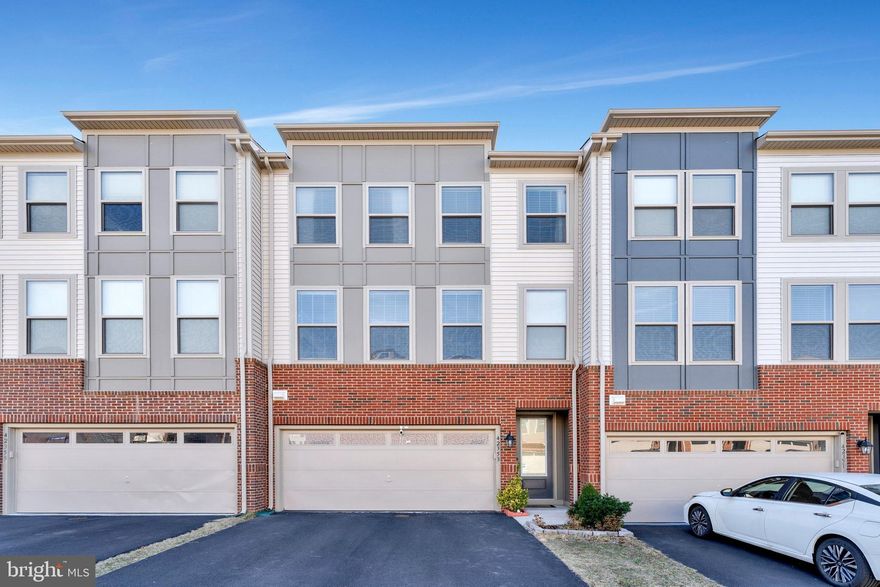 ***Catered Open Houses THIS Weekend! Sat 3/8 12-2pm and Sun 3/9 12-2pm*** Experience modern living in this North-East facing 3-bedroom, 3.5-bathroom townhome located in the sought-after Stone Ridge community of Sterling, VA. Built in 2019, this meticulously maintained property offers almost 2,600 square feet of bright and open living space across three levels.

The main level features an inviting open-concept design, ideal for entertaining. The gourmet "white & white" kitchen is equipped with stainless steel appliances, quartz countertops, a stylish backsplash, and a spacious extended island. The adjacent dining and living areas flow seamlessly, creating a warm and inviting atmosphere, while a bonus breakfast/coffee area and powder room near the kitchen provides additional space for everyday convenience. 

Upstairs, the expansive primary suite includes a luxurious en-suite bathroom with dual vanities and a walk-in shower, along with a large walk-in closet. Two additional bedrooms share a full bathroom offering comfort and flexibility. Laundry on the bedroom level sets you at ease. The lower level features a versatile recreation room and a third full bathroom, perfect for gatherings, a home office, gym, or guest suite. 

This home also includes significant capital improvements, such as a fence (2019) , a beautiful large deck to relax (2019), a patio (2022) perfect for hangouts, and a humidifier for enhanced comfort. The garage has been thoughtfully finished, blending functionality with style. Additional upgrades include custom blinds and ceiling fans throughout.

Enjoy all the amenities that the Stone Ridge community has to offer, including multiple pools, a clubhouse, a fitness center, miles of scenic walking trails, playgrounds, sports courts and community events year-round. 

This elegant townhome is situated in a prime location, offering easy access to a variety of shopping, dining, grocery and recreational options, including Dulles Landing Shopping Center, Dulles Town Center, One Loudoun, and Reston Town Center. Commuters will appreciate the proximity to major transportation hubs, including walk-in distance to Loudoun county transit bus stop, US 50, Dulles International Airport, Route 28, Route 7, and the Dulles Toll Road.

Don’t miss this opportunity to own a stunning, move-in-ready home with thoughtful upgrades in one of Northern Virginia’s most desirable neighborhoods!