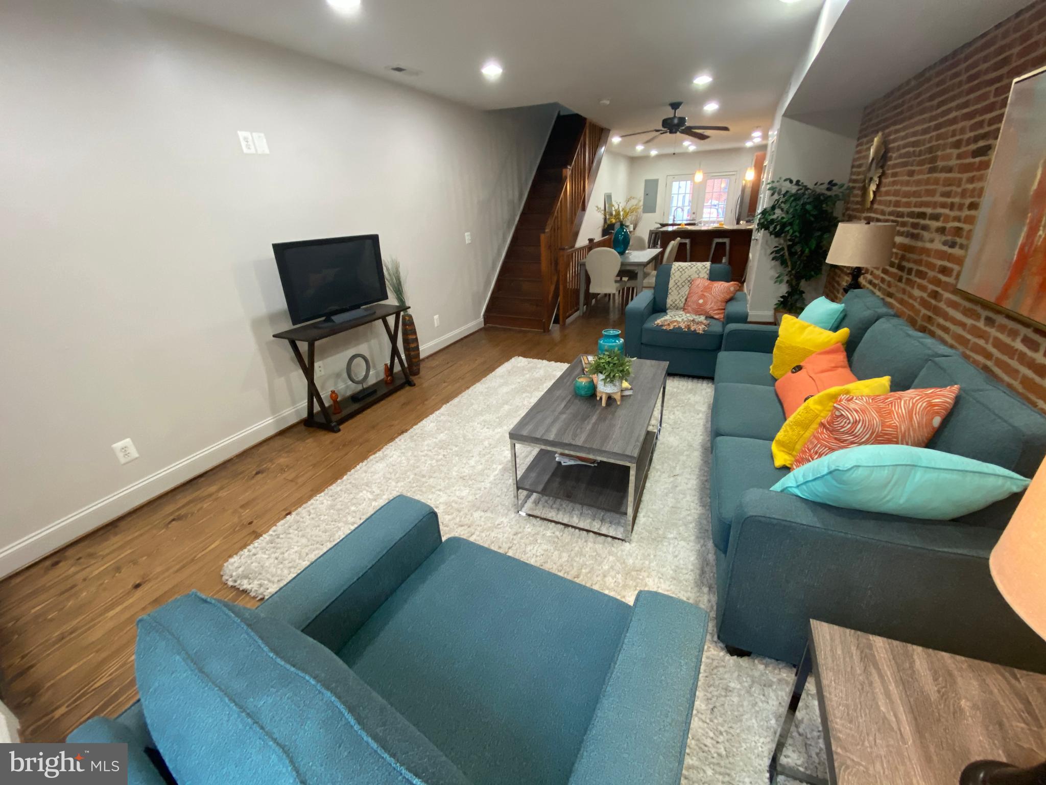 Welcome to 1832 Light Street – a beautifully maintained rowhome nestled in the heart of vibrant Federal Hill. This spacious and thoughtfully designed residence offers 3 bedrooms and 3 full bathrooms across three fully finished levels. The main floor showcases rich hardwood flooring, exposed brick accents, built-in bookshelves, and recessed lighting, creating a warm, character-filled living space. The kitchen is outfitted with stainless steel appliances, granite countertops, and a functional breakfast bar—ideal for both casual meals and entertaining.
Upstairs, you’ll find two generous bedrooms, two full bathrooms, and access to a rooftop deck offering sweeping city views—perfect for relaxing or enjoying sunsets over Baltimore. The fully finished lower level includes a third full bath and provides a flexible space that can be used as a third bedroom, home office, gym, or media room.
Situated in one of Baltimore’s most sought-after neighborhoods, this home is within walking distance to all that makes Federal Hill so special. Savor local favorites like Barfly’s, Barracuda’s Locust Point Tavern, 101 Deli Bar, and the ever-popular Cross Street Market, which now features a dynamic mix of vendors offering everything from gourmet coffee and baked goods to tacos and sushi. Just a short stroll away, Riverside Park offers green space, playgrounds, and a community pool, while the nearby Inner Harbor provides iconic waterfront views and cultural attractions.
With boutique shopping, grocery options, fitness studios, and convenient public transit all close by, 1832 Light Street combines historic charm, updated interiors, and unbeatable urban accessibility—making it a standout home in the heart of Baltimore.