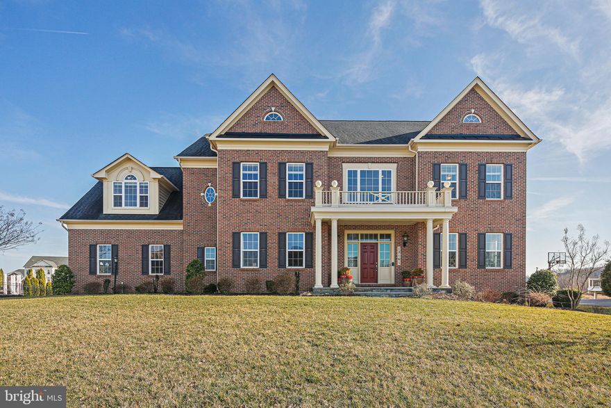 Looking for the perfect home? Look no further than this gorgeous property with all the features you have been searching for!  As you enter, you will be immediately impressed by the grand 2-story foyer with a curved staircase that sets the tone for the rest of the home. The 2-story family room is perfect for entertaining with its cozy gas fireplace and ample natural light. A convenient back staircase is a great asset.  The stylish kitchen boasts granite countertops and stainless steel appliances, while a mudroom offers practicality and convenience. Enjoy the great outdoors from your screened porch which overlooks beautifully landscaped grounds.  The primary suite is a true oasis, complete with a sitting room and attached bath.  The finished lower level provides extra space and includes a 5th bedroom and full bath.  Potential energy efficiency is key with owned solar panels, and 3 HVAC systems. The property also boasts a 3-car garage, classic brick front, and ample driveway parking.  Conveniently located near major routes and amenities.  This home offers the perfect combination of luxury and convenience. Don't miss out on this amazing opportunity! Make this house your new home. Some photos are virtually staged. Please verify the schools with the county school board.  HOA documents are online.