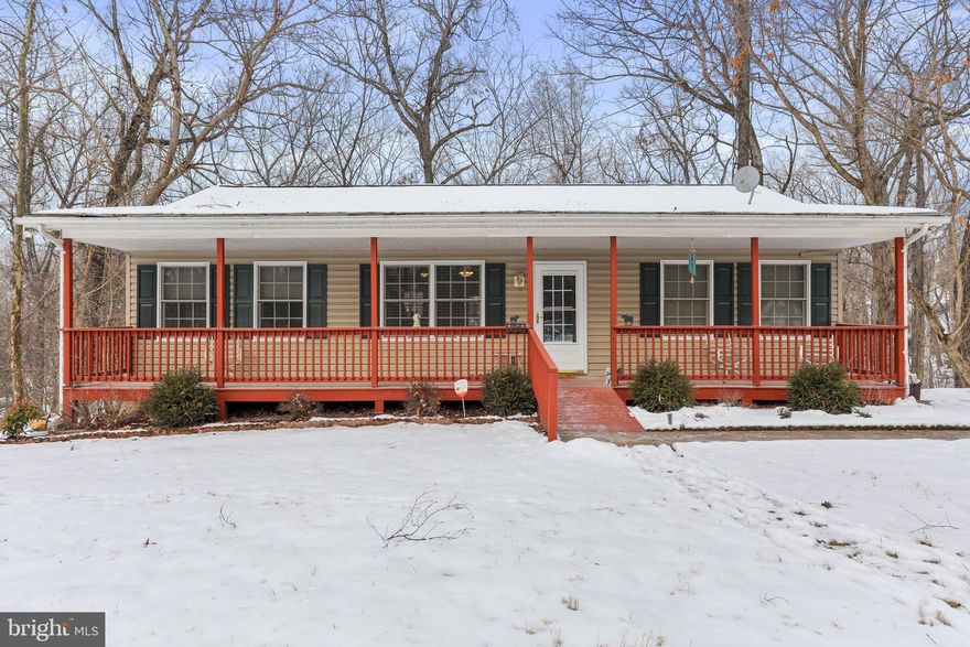 Fantastic rancher conveys on three wooded lots. Large living room, kitchen with pantry and table space, deck off the dining area, three bedrooms and two full baths on main living area including primary bedroom en suite.  Primary bedroom is opposite the guest bedrooms and has a nice walk in closet.  Lots of storage available on the main level plus full size unfinished basement, heated and insulated.  The laundry is on the lower level and washer and dryer convey along with water softener.  The home has a full length, covered front porch, sidewalk from the concrete driveway, and lovely views all year round.  Just a minute or two from Chestnut Hill Road and easy commute toward Leesburg, Charles Town, or Maryland.  Community has River, Pool, and Clubhouse Access available for a fee.  Hot tub and chest freezer convey!