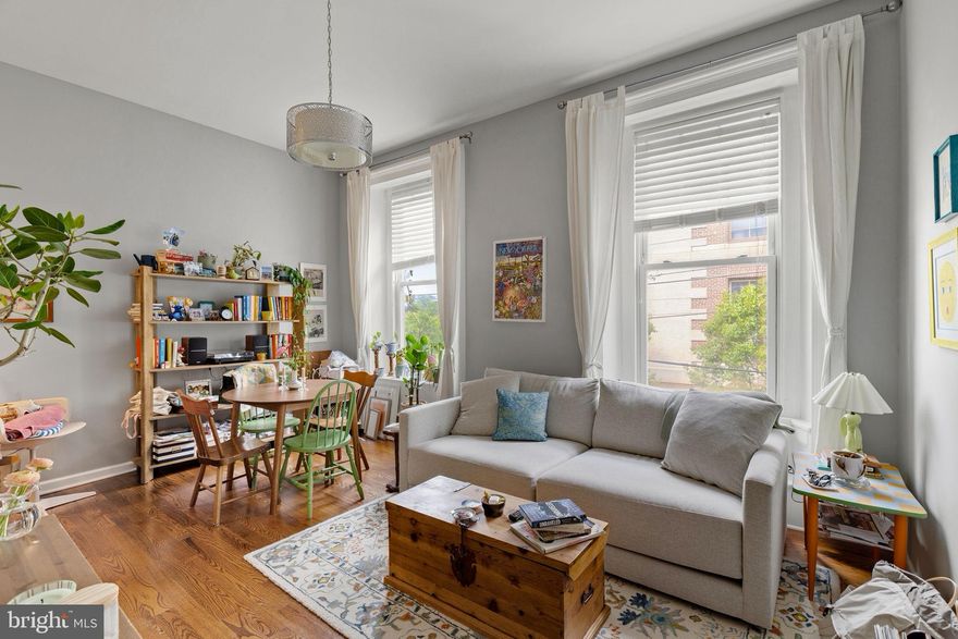 Welcome to your perfect city retreat! This stunning 1-bedroom, 1-bath condo offers the ideal blend of character, comfort, and unbeatable outdoor space — including your very own PRIVATE ROOF DECK with sweeping skyline views. Step inside and you’ll immediately notice the charm: soaring nearly 15-foot ceilings create an airy, dramatic feel, complemented by beautiful hardwood floors throughout and a thoughtful mix of classic details with modern upgrades. The stylish eat-in kitchen is designed for both everyday living and entertaining, featuring quartz countertops, stainless steel appliances, and plenty of space for morning coffee or hosting friends for dinner. The bedroom is generously sized with an oversized closet and custom storage solutions, making city living feel effortless. Additional conveniences include a large private storage closet in the basement — perfect for bikes, seasonal items, or extra belongings. Outside, enjoy not only your private rooftop escape, but also a shared backyard space ideal for relaxing weekends or casual gatherings. And the location truly can’t be beat: tucked away on a quiet residential block, yet just moments from Center City and surrounded by some of Philadelphia’s best restaurants, cafes, nightlife, and neighborhood favorites. Whether you're heading out for brunch, happy hour, or a night on the town, everything you love about city living is right at your doorstep. Skyline views, outdoor space, stylish finishes, and an incredible neighborhood — this condo checks every box.