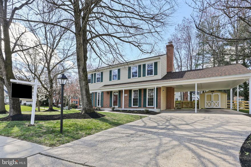 This captivating Colonial home, boasting 4 bedrooms and 3.5 baths, truly is a gem nestled in a Corner Lot. Stepping inside from the Covered Porch, you are greeted by luxurious Vinyl Plank flooring that spans the entirety of the Main Level. The Bright Living Room, featuring a Gas Fireplace and custom built-ins, seamlessly flows into the Dining Room, creating an inviting space for gatherings. The newly remodeled Kitchen is a chef's dream, offering Stainless Appliances, Gas stove, Quartz Counters, White Cabinets, and a Large Pantry. You can access the charming Sunroom, adorned with all-new windows and sliding glass doors, perfect for enjoying morning coffee or alfresco dining. Adjacent to the Kitchen is the large pantry and laundry room, leading to the 2 car covered parking spaces with pull-down storage space and storage shed. Also on this level, a cozy Family Room features a Gas insert Fireplace, ideal for relaxation. A convenient Half Bath completes this level. Upstairs, two Primary Bedrooms feature large walk-in closets, new carpet throughout, and attached bathrooms, one also accessible from the hall. The third upstairs Bedroom provides ample space with its own closet and carpeted floor. The Lower Level offers the Fourth Bedroom with a closet, connecting to a Full Bath with a Stall Shower and Tile Flooring. Additional living space with a Rec Room is perfect for movie nights or a kids' play area, a Bonus Room offering versatility as an Office or Craft Room, and the Utility Room ensures ample storage with built-in shelving. Also featured are two walk-in closets for additional storage. Stepping outside to the Fenced Rear Yard offers a serene space for outdoor relaxation. The home also features a New Roof in 2021, New HVAC in 2021, and a New Water Heater in 2022. This home is Move-In Ready, presenting an exceptional opportunity to experience comfort and convenience in every detail.