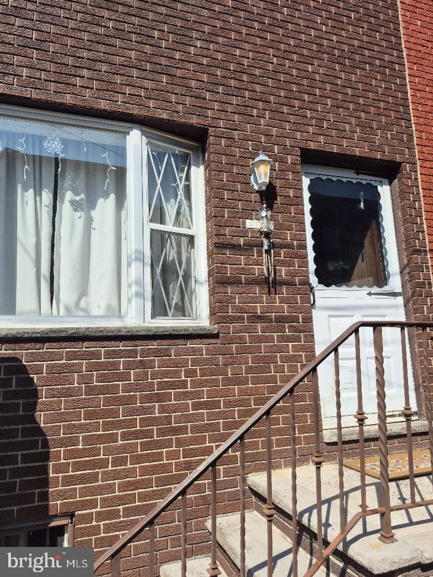 The main level features a traditional layout with a welcoming living room, formal dining area, and a functional kitchen that opens to a spacious rear yard—perfect for relaxing or entertaining. A full basement provides laundry facilities and ample utility and storage space.

Upstairs, you’ll find three comfortably sized bedrooms along with a classic tiled bathroom. The home’s distinctive 1980s-style brick front adds character, while the surrounding block is lined with equally charming, well-kept homes.

Don’t miss your chance to own this unique and well-cared-for property—schedule your showing before it’s gone!