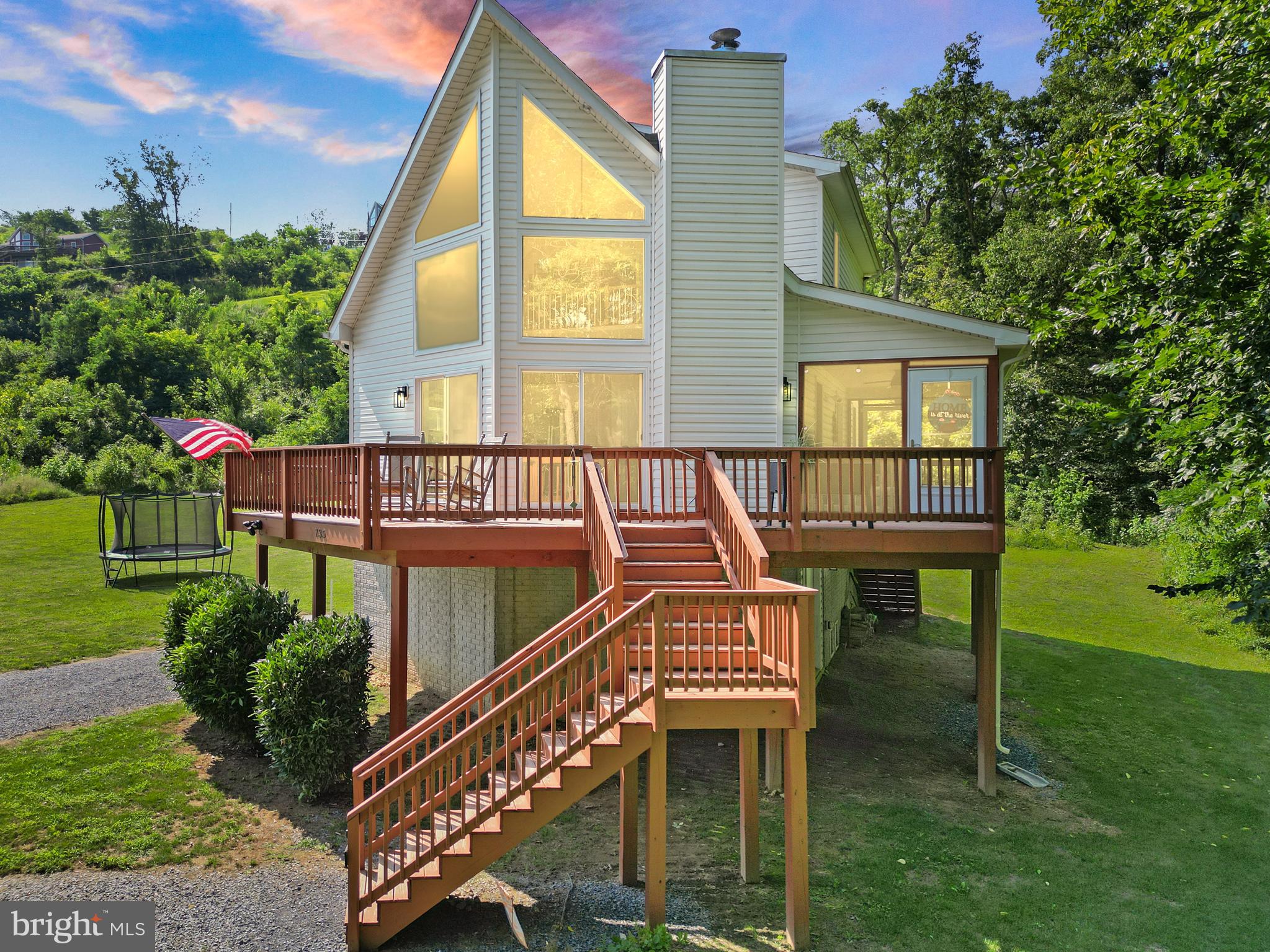Riverside Luxury Meets Shenandoah Serenity — Modern Chalet with Private River Access & Mountain Views
Welcome to your dream escape in the heart of the Shenandoah Valley — a stunning custom-built chalet perched above the Shenandoah River, offering private river access and panoramic views that will take your breath away. Built in 2022 with both beauty and functionality in mind, this remarkable home blends contemporary design with the peaceful rhythm of nature, making it an ideal primary residence, weekend retreat, or income-generating Airbnb.
Tucked away in scenic Warren County, just minutes from downtown Front Royal, this exceptional property overlooks the gently flowing Shenandoah River and a picturesque neighboring farm. From the moment you arrive, the setting speaks to relaxation and renewal — where the gentle curve of the river mirrors the home's thoughtful architectural lines.
Step inside to a bright and open great room filled with natural light, thanks to oversized windows that frame the tranquil outdoor scenery. The seamless flow between the living, dining, and kitchen areas makes this space as perfect for entertaining as it is for quiet evenings in front of the cozy fireplace. The chef-inspired kitchen features sleek, modern finishes, stainless steel appliances, abundant counter space, and a stylish breakfast bar — ideal for everything from morning coffee, to homework, telework, or casual gatherings.
With four bedrooms, including a luxurious generously sized primary suite with a spa-like en-suite bath and huge walk in closet, there’s room for everyone to enjoy a peaceful retreat. You can also enjoy your perch overlooking the great room and out the expansive windows out to the river from the second floor loft that would make a great office, library, classroom, etc... Whether you're hosting friends, welcoming extended family, or accommodating guests, this home offers comfort, privacy, and refined touches throughout.
The outdoor living spaces are where this property truly shines. A sprawling deck and screened-in porch invite you to dine al fresco, sip wine under the stars, or simply soak in the uninterrupted views of the river. The expansive fenced yard is ideal for outdoor recreation, firepits, or creating your own garden oasis. You can also sit back and relax at the river's edge or even grab some tubes and have a float. Three river front recreational lots have been added to this property to increase the property size and value as well as add direct river access. They are not making any more River Front Property!
Location is everything — and this chalet is perfectly positioned near at the end of the road so no through traffic, yet near Skyline Drive, Shenandoah National Park, Shenandoah River State Park, local wineries, hiking trails, caverns, and countless outdoor adventures, making it a magnet for vacationers and nature lovers alike. It's only 10 minutes to Spelunker's - If you don't know what this means, you need to find out now!
Whether you're looking for a serene year-round home, a turnkey vacation property, or a lucrative short-term rental, this one-of-a-kind chalet delivers. Don’t miss your chance to own a slice of Shenandoah paradise — where modern luxury meets timeless natural beauty.
***VA ASSUMABLE LOAN*** ***MOSTLY FURNISHED***