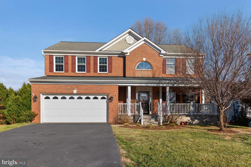 Welcome to this exceptionally updated 5-bedroom, 3.5 bathroom home in the sought after community of Blooms Crossing in Manassas Park! Fresh designer paint and all new flooring. This stately brick-front colonial offers nearly 3500 square feet of beautifully updated living space situated on a prime lot with fully finished walkout basement and flat rear lot at the end of the Cul-de-sac. With great curb appeal the exterior features front porch entrance, 2-car garage with Tesla charging port, Trex deck with pergola, patio with hot tub and more. Great location close to Prince William Parkway, VRE, an easy drive to Route 28, and in close proximity to plenty of diverse shopping, dining, and entertainment choices in downtown Manassas. Outdoor enthusiasts will love nearby Blooms Park, Signal Hill and Signal Bay Water Park, Fountainhead Regional Park offering acres of natural beauty and endless outdoor activities.