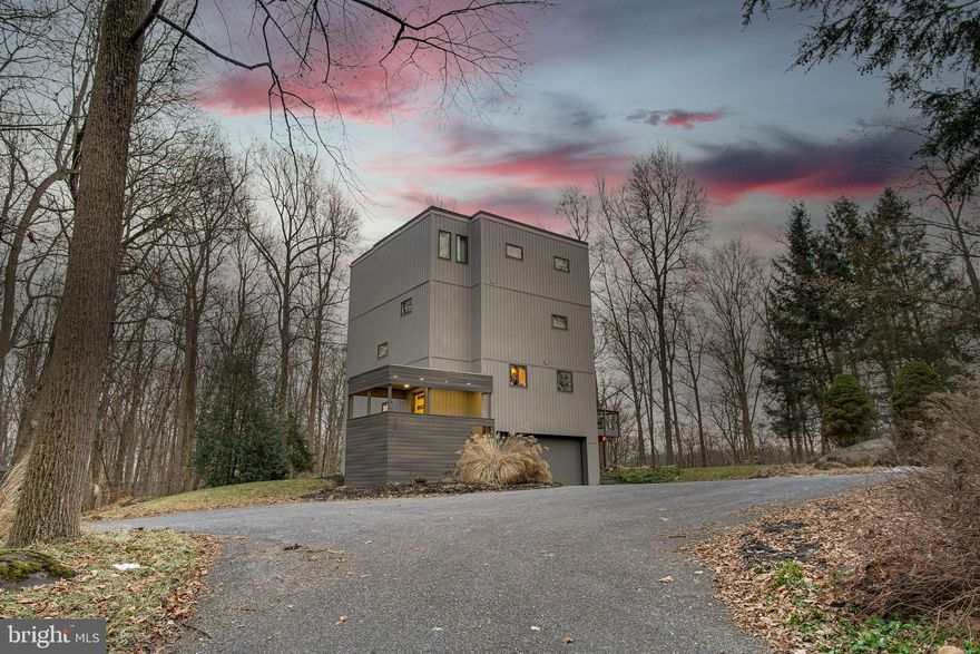 Interior photos now uploaded!! Welcome to your fully furnished, private 12-acre retreat!! Where modern design meets peaceful wooded serenity. This stunning 4-bedroom, 2.5-bath contemporary home is tucked away on 12 beautiful wooded acres, offering the perfect blend of privacy, comfort, and opportunity. Soaring ceilings and expansive windows flood the living room with natural light, creating a bright and airy space that seamlessly connects indoor living with the beauty of the outdoors. The third-floor primary suite is a true sanctuary, featuring a spacious walk-in closet and a spa-inspired en-suite bath complete with a soaking tub and dual vanities. Three additional bedrooms offer flexibility for family, guests, or the perfect home office setup. Step outside onto the deck and take in the peaceful views of your own wooded haven - ideal for morning coffee, outdoor dining, or simply unwinding in nature. Just below the deck on the patio, you’ll find a private hot tub, creating the perfect space to relax and fully embrace the tranquility of this secluded setting.
Currently operating as a professionally managed short-term rental, this property offers an incredible turnkey investment opportunity. All furnishings and home contents are included in the sale - making this a immediate income opportunity or fully furnished private residence.
An extra feature is the massive 30’x44’ detached garage. Whether you envision RV storage, a large workshop, an indoor recreational space, future pool installation, or something entirely unique - this property offers exceptional flexibility for future amenities. The entire lane has also been recently paved, providing smooth, easy access to the property .
Also enjoy total tranquility while still being conveniently located less than 15 minutes from year-round adventure at Roundtop Mountain Resort and outdoor recreation at Pinchot Lake.
Whether you're seeking a peaceful primary residence or a fully furnished income-producing retreat - this property delivers privacy, and limitless potential.  With 12 wooded acres, there is abundant room to expand, create, and truly dream big. You won’t want to miss this one - schedule your tour today!!