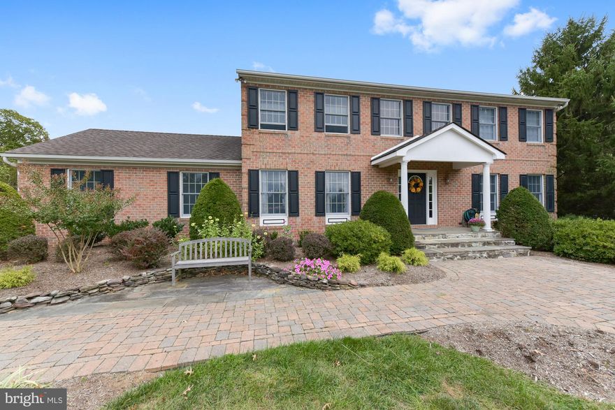 This stunning brick, custom home in the highly sought-after Greens neighborhood features a beautifully  landscaped yard that will make entertaining a delight. The quiet, fenced oasis features an extra large patio, pergola, firepit,  abundant flowers and trees and plenty of flat, open space! This home features upgrades galore--including hardwoods on the first and second levels, moldings,  and plenty of windows with views of the lovely yard. The main level features a formal dining room, bonus room for use as a living room or office, family room, half bath and a great gourmet kitchen. Enjoy cooking in this gourmet chef's kitchen--with up-to-date gray cabinetry,  large center island, granite, custom tile backsplash and eating area! The upper level features four bedrooms--with a Master bedroom suite with a volume ceiling,  upgraded storage closet with glass doors and a spa-like Master bath with soaking tub, tile shower and granite counters with dual sinks. Guests will love the fully finished basement with wet bar and separate spaces for relaxing and entertaining. This fantastic home is a must see!