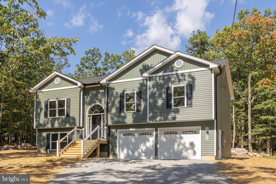 **Final pictures are up!! READY TO MOVE IN! $600 towards Starlink service purchase and installation!** 

Welcome to your future dream home! New construction, completed and ready to move in! This beautifully designed split foyer blends modern living with classic comfort. Situated on a spacious 1/3-acre lot, this 1909 square foot home offers plenty of room to grow, relax, and entertain—inside and out. The front porch offers graciously wide steps and vinyl railings, setting the expectation of quality craftsmanship outside and in.

Stepping inside, high expectations are exceeded as you experience the 9'-ceilings and inviting open-concept layout, where the living room, dining area, and kitchen flow seamlessly together—ideal for gatherings, daily living, and everything in between. Natural light pours through energy-efficient windows, highlighting high-quality finishes and thoughtful design throughout including upgraded trim and lights.

The upper level boasts a spacious primary suite with a full bath, plus two additional bedrooms and another full bath. Downstairs, a fully finished lower level features a large bonus living area and a half bath—perfect for a home office, guest suite, or rec room.

The kitchen comes complete with granite tops and upgraded cabinetry featuring soft-close doors and drawers. Bathrooms also enjoy granite tops and tile showers.

Additional highlights include durable and stylish vinyl plank flooring throughout main areas and primary bedroom. a generously-sized two-car FINISHED garage, and a level lot with room for outdoor living, gardening, or play.

Located in Wilde Acres, a community that offers a mountain lake, playground, picnic area, volleyball and basketball courts, plus scenic hiking trails leading to a beautiful nearby waterfall. Quiet and secluded but easy and convenient access to local amenities.

Whether you're looking for your first home or your next chapter, this brand-new split foyer offers functionality, flexibility, and fantastic value. Don’t miss your chance to personalize finishing touches—schedule a tour or consultation today! Be sure to ask about the Starlink offer!