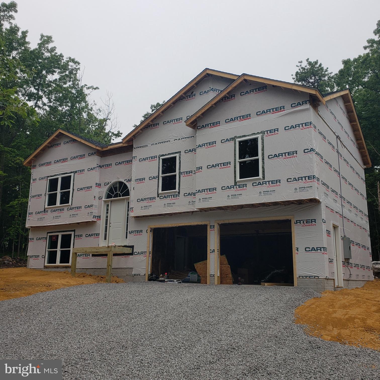 **7/10 - Many selections still able to be made within the next two weeks!** Welcome to your future dream home! Currently under construction, this beautifully designed split foyer blends modern living with classic comfort. Situated on a spacious 1/3-acre lot, this 1909 square foot home offers plenty of room to grow, relax, and entertain—inside and out.
Step inside and experience the inviting open-concept layout, where the living room, dining area, and kitchen flow seamlessly together—ideal for gatherings, daily living, and everything in between. Natural light pours through energy-efficient windows, highlighting high-quality finishes and thoughtful design throughout.
The upper level boasts a spacious primary suite with a full bath, plus two additional bedrooms and another full bath. Downstairs, a fully finished lower level features a large bonus living area and a half bath—perfect for a home office, guest suite, or rec room.
Additional highlights include durable and stylish flooring throughout main areas. a generously sized two-car garage, and a level lot with room for outdoor living, gardening, or play.
Located in Wilde Acres, a community that offers a mountain lake, playground, picnic area, volleyball and basketball courts, plus scenic hiking trails leading to a beautiful nearby waterfall. Quiet and secluded but easy and convenient access to local amenities.
Whether you're looking for your first home or your next chapter, this brand-new split foyer offers functionality, flexibility, and fantastic value. Don’t miss your chance to personalize finishing touches—schedule a tour or consultation today!