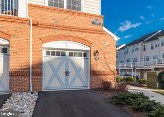 Sun filled end-unit in the Ridges at Loudoun Valley Condominium. Newly built in 2018 with 2 primary suites, this property is ready for you! The main level neutral paint and high-end finishes make the perfect backdrop for your furnishings. Upgrades include gourmet kitchen with white cabinets, subway tile backsplash and granite counters, crown molding, hardwood floors, upgraded lighting and more. Spacious main level includes dining area and large island for more casual dining. Enjoy a private balcony, perfect for relaxation. 1 car attached basement garage with extra storage space, or your own personal gym! Fantastic community amenities include outdoor pool, tennis courts, and more. Convenient location in Loudoun Valley II just minutes from the Loudoun County Pkwy, shopping, dining, breweries and wineries and Dulles International Airport. Enjoy and welcome home!