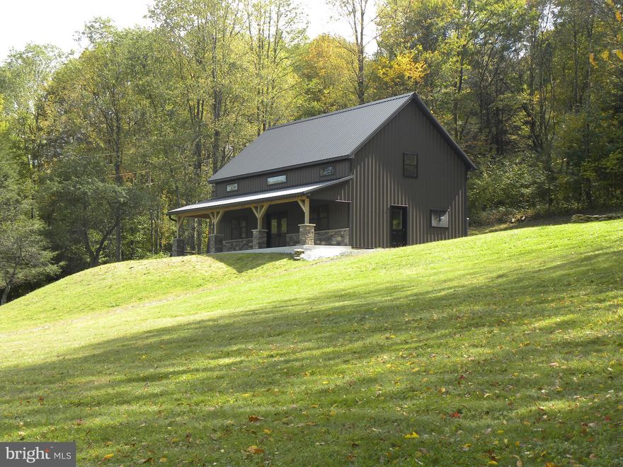 Looking for Your Dream Retreat??  – 4.08 Acres in Eglon, WV!  Escape to your own private haven on two separate parcels totaling 4.08 acres, partially wooded and tucked away in a peaceful location near Deep Creek Lake, MD, and Blackwater Falls, WV. This newly built barndominium offers open-concept living with quality construction and the essentials already in place: spring-fed well, septic system, and electricity.  Inside, discover spacious lofts and roughed in plumbing and ready for you to complete and personalize to your taste. A storage shed adds extra convenience for tools, toys, or outdoor gear.  Whether you’re looking for a serene retreat, a nature-filled weekend getaway, or a place to create your dream home, this property combines privacy, versatility, and a stunning location in the heart of West Virginia’s natural beauty.