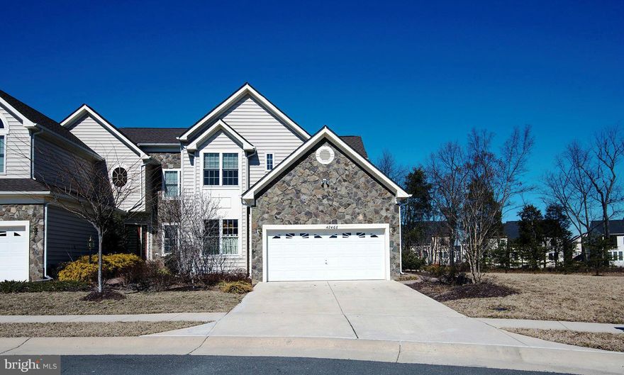 Former Toll Brothers Model  w/approx. 4,400 fin sqft. , 2 car Gar & tons of exquisite upgrades truly feels like a single family. Gourmet Kitchen w/top of the line SS app ,high end cabinetry, granite, wide plank floors, extensive wood trim throughout. Custom built-ins, Lux Master Suite w/spa-like bath, Huge Rec Room with bar. Private yard backing to trees,deck & a custom patio