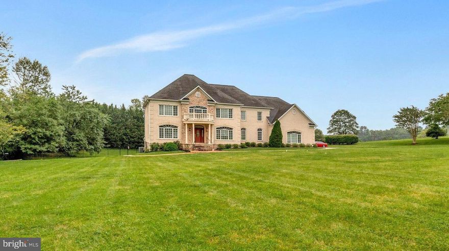 $50,000 Price Improvement! Welcome to 2901 George Howard Way — One of Davidsonville’s Finest Homes. Prepare to be impressed by this custom residence located in the exclusive Governors Manor community of Davidsonville, MD. This property boasts over 8,000 square feet of living space, six spacious bedrooms, seven luxurious bathrooms, and sits on two beautiful acres. This home blends elegance, comfort, and functionality, offered at under $2 million.
Governors Manor is one of the area’s most coveted neighborhoods, with just 20 estate lots.  From the moment you arrive, the charm is unmistakable: gracious architecture, sprawling lots, and timeless design make this community truly special.
Location is everything. You're just minutes from Historic Annapolis, Riva, and South County, with convenient access to Route 50, Route 214, and I-97—ideal for commuting to Washington, D.C., or Baltimore. Outdoor lovers will enjoy nearby Davidsonville Park, Renditions Golf Course, Bell Branch Dog Park, and Allen Pond. And yes, you’ll find many restaurants within 5 miles—everything you need is right at your doorstep.
As you pull into the long private driveway, you will see the grand front entrance, side-load garage, and expansive open yard. Step inside, and you’ll immediately appreciate the attention to detail: a stunning central staircase, formal living and dining rooms with custom finishes, and a beautifully appointed home office.
The heart of the home is the open-concept family room, featuring two-story ceilings, walls of windows, custom built-ins, and arched doorways. The adjacent gourmet kitchen features stone countertops, high-end appliances, and a spacious breakfast area, perfect for daily living and entertaining. 
Upstairs, you'll find three generously sized guest bedrooms, each with its own private en-suite bath. The spacious primary suite is a true retreat, boasting dual walk-in closets, a large sitting area with backyard views, and a lavish spa-like bath featuring marble throughout, a walk-in tub, and a steam shower. The primary suite even includes its own second kitchen for added convenience.
The fully finished lower level adds an additional 2,000+ square feet of flexible living space, including two oversized bedrooms, a full bathroom, a home gym area, and a dog washing station. You'll also find a third kitchen, perfect for entertaining, plus an expansive recreation area ready for your game table or pool table. And of course, the jewel of the lower level: your own private theater room, ideal for movie nights or weekend sports.
This home offers unmatched space, design, and amenities—inside and out—in one of Davidsonville’s most exclusive enclaves. If you’re looking for luxury, privacy, and location, this is the one.
Don’t miss your chance to own this beautiful home. Schedule your private showing today.