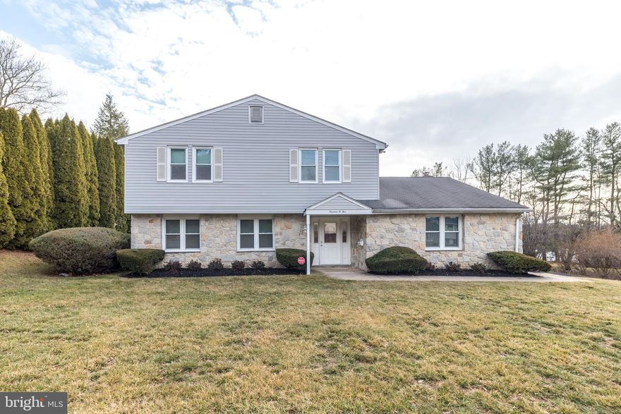 Discover the perfect blend of comfort, style, and versatility in this charming and well maintained 4-bedroom, 2.5-bath colonial. With 2,300 square feet of living space this home is designed for both relaxed living and memorable entertaining.   Step inside to find a formal living room and dining room that flow effortlessly—ideal for hosting gatherings. The bright and inviting kitchen features timeless white cabinetry, elegant quartz countertops, a stunning tile backsplash, and a picture window overlooking the serene backyard. There's also ample space for a breakfast area , creating the perfect spot for casual meals or your morning coffee.  The heart of the home is the spacious family room, showcasing a striking stone accent wall, a cozy wood-burning fireplace, and sliding doors that lead to the patio—perfect for seamless indoor-outdoor living. An adaptable office on the main floor offers endless possibilities—it could easily serve as a playroom, home gym, or even be converted back to its original two-car garage layout. Completing the first floor is a convenient powder room and laundry area.  Upstairs, the primary suite is a private haven with a ceiling fan and a beautifully remodeled en-suite bath featuring a modern stall shower with glass doors. Three additional bedrooms provide generous space for family or guests. The well-appointed hall bath includes two sinks, ensuring plenty of room for busy mornings. A hallway door leads to a partially floored attic, one of the two attics,  offering abundant storage or potential for future expansion.  Additional highlights of this home include a one year home warranty, recessed lighting, replacement windows throughout, and an alarm system for added security and peace of mind. Outside, the large, flat backyard invites endless opportunities for play, gardening, or simply relaxing in your own private retreat.  Located in the top rated Upper Dublin School District with its two newly built and state of the art schools - Upper Dublin High School and Sandy Run Middle School. Situated within close proximity to shopping, restaurants, the Promenade, Life Time Fitness, train stations and major arteries.  This lovely home offers a spacious layout and a prime location you'll be proud to call your own.