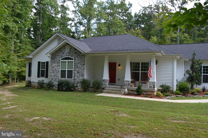 Secluded hide away, this fabulous modern rambler features 4 Bedrooms, 3 Full Bathrooms , an open floor plan and a sunroom. On a private drive, It sits on 2 acres, and is sounded by woods. Close to Quantico, Marine Base, and great shopping, this home is also walking  distance to a local winery.  If you are looking for a place to escape to... Look no more