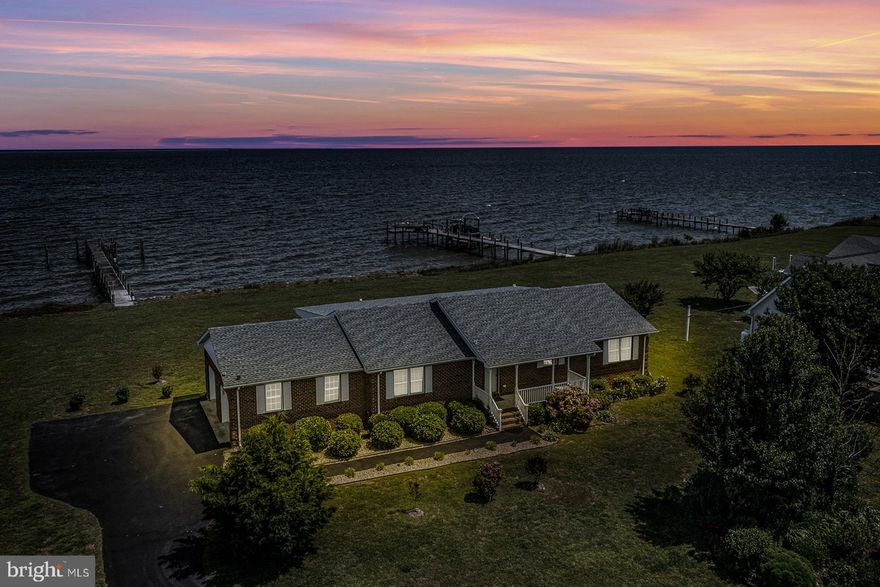 Attractive BRICK 2004 Built Potomac RiverFront Home. Interior Highlights: 3 Bedrooms, 2 Full Baths, Very Nice Open Floorplan plus vaulted Ceilings, Large Great Room with Fireplace, Dining Area, Oversized Kitchen with lots of Cabinetry along with Granite counters and 2 pantries, waterside Primary Suite with access to porch, Primary Bath with Dual Sinks plus a separate shower and a walk-in closet, Split Floor plan offers privacy with the guest bedrooms/Bath on the opposite side as the primary bedroom, Gorgeous Wood Floors Throughout, & MUCH MORE! Exterior Features include: 20x5 covered concrete front porch, Fantastic entertaining Waterside 27x16 Screen porch plus a 27x16 covered Deck, paved Driveway and Sidewalk. The 23x24 two-bay garage gives plenty of storage. On a Nicely Elevated 1.07 acre prime Riverfront lot with Armour Stone protected Shoreline, a Pier & INCREDIBLE VIEWS OF THE POTOMAC & CHESAPEAKE BAY (within Sight of the Shipping Channel). The Landscaping and plantings are beautiful with things in bloom year around. Located in the very well-kept Neighborhood of Potomac Bay Estates and nearby are numerous towns, golf, wineries, restaurants and shopping. You will not be disappointed with this well built home and Mesmerizing Water Views Everywhere you look. High Speed Internet "Breezeline" is available. Community water fee included in annual dues of $625 per year!