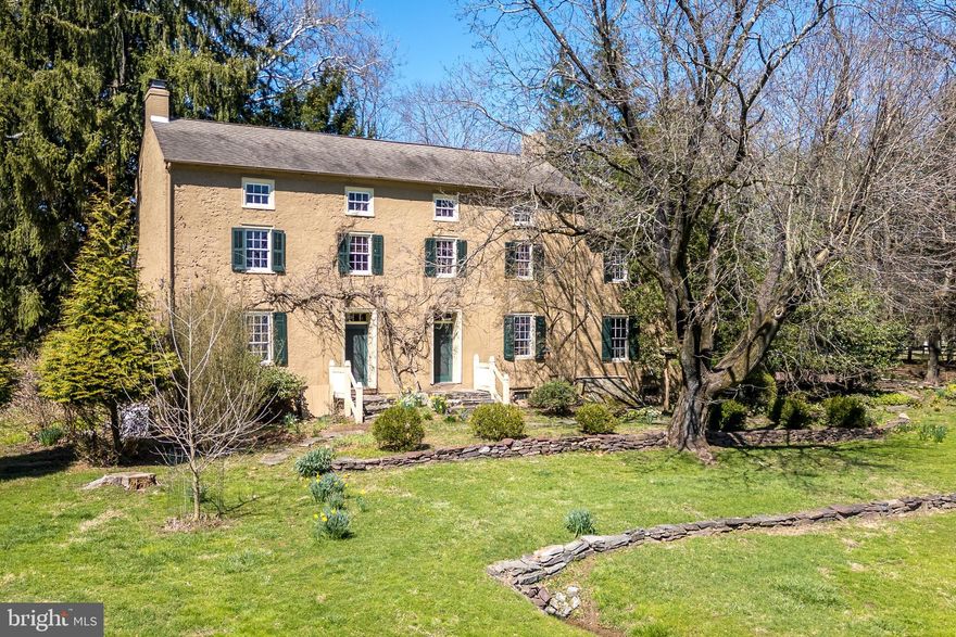 Welcome to Broadview Farm! Nestled in the tranquility of Buckingham Township, Bucks County, Pennsylvania, this timeless Federal-style home dating back to circa 1730 offers a retreat from the ordinary. Set on 10.9 acres, this remarkable property boasts the main house, an icehouse, a pool with pool house and a barn featuring 3 separate apartments. Surrounded by specimen trees and vibrant flowering bushes, including forsythias and enchanting magnolia trees, the setting is truly park-like. As you step into the 2700+ sq. foot plaster over stone farmhouse, the spacious rooms greet you with warm Pumpkin Pine and Oak flooring and the light is spectacular.  Many original features remain including built-ins and hardware along with wide windowsills adding charm and character throughout. The bright and cheerful kitchen is the heart of the home with a charming walk-in fireplace and spacious enough for a grand table or an island. Other built-in cabinetry and storage space abound.  The living room features a wood-burning fireplace and cozy seating area along with a more formal dining area for entertaining. Double doors open into the cozy family room - a superb place for reading a good book. Conveniently located on the first floor is a laundry/mud room that provides outside access. A full bathroom with tiled, steam shower completes the main level. Upstairs, three spacious bedrooms with wood flooring await. Each room offers plenty of light. Two bedrooms, one being the primary, offer wood-burning fireplaces. The third bedroom has an ensuite bath with shower. The hall bath has a cast iron clawfoot tub reminiscent of the Victorian era. The third floor offers 2 additional bedrooms with a center room for lounging or use as a computer area. All pine floors under the carpeting. There are 5 heating zones, and a new oil furnace was installed in 2023 with a transferable warranty. The whole house automatic generator is serviced by natural gas, and gas ports were installed with the forethought that any appliances or utilities could easily be converted. The grounds surrounding are magnificent, with stone walls, wrought iron railings and gate, mature landscaping, flagstone walkways and patio areas and room for outdoor entertainment. Above the back door a nostalgic emblem harkens back to yesteryear, signifying the payment of fire insurance and ensuring assistance from the fire department. Both the pool house and attached screened porch offer a welcome retreat for lunch or dinner parties or simply relaxing with a good book and a glass of your favorite wine. The small garden shed beyond the pool house is adorable with cedar shake roof. The barn has at least 3 stalls that would accommodate horses or other livestock with plenty of fenced pasture. 5 miles to either New Hope or Doylestown, 7 miles to Newtown. Easy access to major commuter routes to NY, NJ and Philadelphia. Award winning Central Bucks School District or enjoy one of the many prestigious private schools in the area. This property epitomizes the quintessential Bucks County lifestyle--schedule your private showing today.