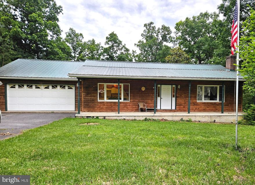 Your own piece of paradise in the woods with nearly 3 acres...

Mature trees to shade you and provide that privacy desired...on the back deck overlooking the large pond down below.  It's a great place to sit and relax.  The house bolsters new paint and appliances to come, hardwood flooring and tile, recent roof, and cedar log siding...it's a turnkey property ready for you!  You can take advantage of everything this home and land has to offer.  Then, enjoy winter time by the large fireplace indoors.   It won't last long!