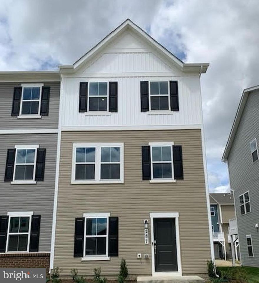 Brand New 2025 Construction – Be the First to Call This Home! This beautiful end-unit townhome offers three fully finished levels and a spacious two-car garage, giving you plenty of room for parking, storage, or even a home gym setup. The lower level features a versatile flex room with luxury vinyl plank (LVP) flooring and a convenient half bath—perfect for a home office, media room, or playroom. The main level boasts an open concept layout filled with natural light. The kitchen seamlessly connects to the main living space, making it ideal for everyday living or entertaining. There’s also a convenient half bath on this floor for guests. Step outside to your oversized rear deck—a standout feature of this home. It’s the perfect spot to grill, relax, or host gatherings. Whether it’s your morning coffee or a summer evening with friends, this space truly shines. Upstairs, you’ll find two generously sized secondary bedrooms, a full hallway bath, and a laundry closet for added convenience. The primary suite features soft carpeting, recessed lighting, a walk-in closet, and a private en-suite bath with dual vanities, LVP flooring, and a tile shower with a built-in bench. With modern finishes and a fresh, move-in ready feel, this brand-new 2025 home has everything you need. Book your showing today!