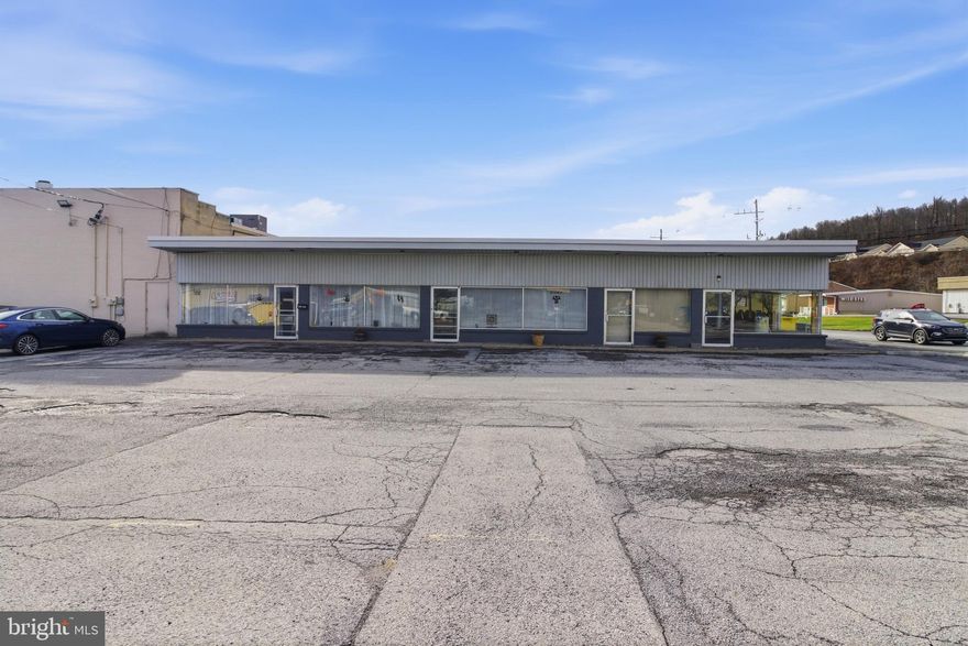 Unlock the potential of this nearly 3,000 sq. ft. commercial building offering exceptional visibility on a high-traffic route in Philipsburg, with 12,000–15,000 cars passing by daily. Ideal for office, retail, or mixed-use, this versatile property features two storefront units. The largest storefront was renovated in 2019, making it modern, clean, and move-in ready. It is currently operating as a massage business and includes multiple treatment rooms, bathrooms, and a convenient laundry area—perfect for professional services, wellness, medical, or office users. The second unit is partially renovated and offers a wide-open layout with a half bath, ready for your finishing touches. Great opportunity for an owner-occupant seeking rental income, or an investor looking for a flexible, high-visibility commercial asset. With strong traffic counts, updated interiors, and adaptable space, this property is positioned for a variety of business types and provides excellent exposure in a growing area. Don’t miss this turnkey opportunity in a prime location!