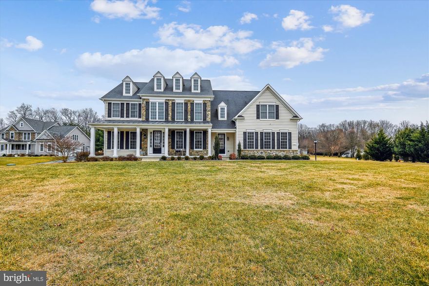 Welcome to this charming traditional home, beautifully crafted with a combination of stone and siding. Offering over 5000 square feet of meticulously designed living space, this home is perfect for both everyday living and grand entertaining.

Upon entering, you're greeted by a stunning foyer with a gracious staircase, setting the tone for the rest of the home. The formal living and dining rooms are ideal for hosting guests, while the entertainer's kitchen, complete with a large center island and pantry, offers everything you need to prepare meals with ease. The spacious breakfast nook, with its bank of windows, overlooks the serene patio and backyard, providing a peaceful place to enjoy casual meals.

The large family room, adjacent to the kitchen, features soaring ceilings and a cozy gas fireplace, creating a welcoming atmosphere. A generously sized home office offers a perfect space for work or study, and an attached three-car garage opens into a large mudroom for added convenience. A powder room and ample closet space round out the main level.

Upstairs, the luxurious primary suite is a true retreat, with a massive walk-in closet and a spa-like ensuite bathroom that includes two separate sinks, a large glass shower, and a soaking tub. Two additional spacious bedrooms share an adjoining bathroom, while the fourth bedroom enjoys the privacy of its own ensuite bathroom. The large laundry room adds to the functionality of this level, while the incredible playroom is the perfect place for toys, games  and stuffies to be enjoyed for hours on end.

The finished lower level is an entertainer's dream, featuring a vast recreation room with natural light streaming in through windows and large walkout doors. An enormous unfinished storage room provides additional space for all your needs.

Throughout the home, you'll appreciate the gorgeous wood floors, recessed lighting, crown moldings, and an abundance of windows that fill every room with natural light. A back staircase leads from the second level directly to the kitchen, providing easy access and added flow.

Step outside and enjoy the lovely front porch, or entertain in the beautiful backyard with its stone patio, perfect for dining al fresco or relaxing in the serene setting. Situated on 1.3 acres of level land, this home offers a gorgeous backdrop for comfortable living.

This home truly has it all – and then some. Come see it for yourself and experience the exceptional beauty and functionality it offers.