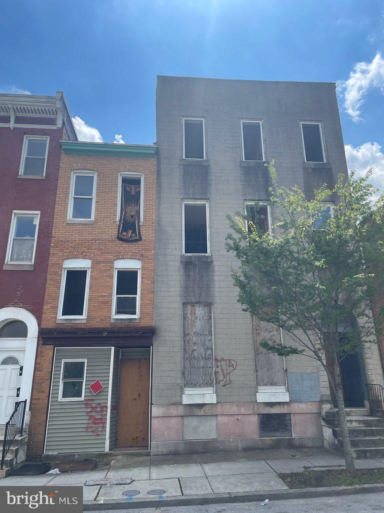 Property is being sold AS IS. Tax Parcel0311060416021. Current zoning is R-7 and encompasses both buildings, 1218 and 1220, each requiring significant rehabilitation. Building 1220 is metered for five units and has a rough-framed interior for six units (two per floor). 1st Floor: framed as a 1BR/1BA and a 2BR/1BA 2nd Floor: framed as two 2BR/1BA units 3rd Floor: framed as two 2BR/1BA units The property has three electrical drops from the pole; the first two are split and feed two meters, while the third is not split and feeds a single meter. Rough plumbing and sprinkler systems have been installed, but no other utilities are in place. Building 1218 is currently metered as a single unit and configured as a 3BR/1BA. Some rehabilitation has been completed, but structural floor repairs are required on the first floor due to fire damage (see photos included in the listing).