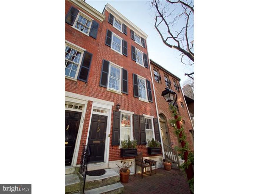 State of the art 4 story masterpiece on the finest & most desirable cobblestone street in Society Hill! 3 bed, 2 bath complete new renovation with top of the line workmanship and materials. The first floor offers a handsome custom chefs kitchen boasting a breakfast bar, stone countertops, custom cabinetry, subway tile backsplash, stainless steel monogram GE gas burning stove with exhaust fan, microwave and dishwasher, Samsung fridge, farm sink and recessed lighting. Formal dining area gleams with beautiful wood floors, custom built-ins and a bar counter with wine cooler, opening into the sun-filled den/sitting room with sliding glass doors out to private, magnificently landscaped Ipe decked garden with planting beds. On the second floor you'll find a wide open double living space with new oak hardwood floors, soaring ceilings, custom crown molding, sunlight from front to back and wood burning FP with mantle and built-ins plus a custom built-in bar. The 3rd floor offers 2 bedrooms and a beautiful tile bath off the hall. The sun-drenched main bedroom suite encompasses the 4th floor complete with its cathedral ceilings, many windows, skylights, built-in desk and shelving, 2 double California closets in addition to a full 4 piece bath with stall shower, Jacuzzi type deep soaking tub with jets and double sink. Fully finished basement with family/media room, Electrolux front load W/D, mechanical room and storage. 2 zoned heating & cooling system (2nd zone only for the master suite).  This entire home is wired for smartphone controlled SONOS system to have full music capability on every floor, with built-in ceiling and wall speakers on the first and second levels! Pride of ownership truly lies in this one of a kind townhome found on an elite street in the highly-coveted neighborhood known as Society Hill. 1 year prepaid garage parking at 2nd and Lombard.