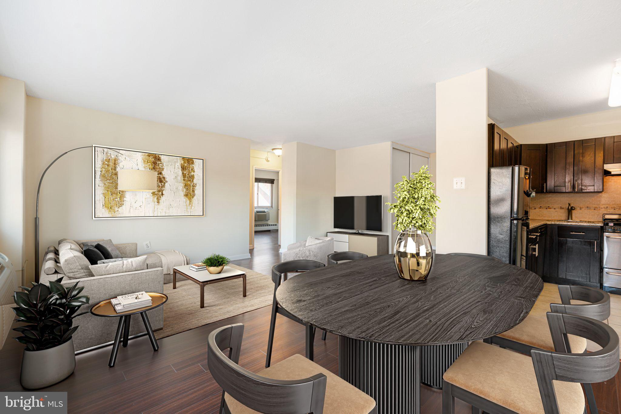 Welcome to Unit 518 at River West Condominiums — a spacious and stylish two-bedroom, one-bath condo located in the heart of Rittenhouse Square. Perched on the 5th floor, this bright and inviting home features gorgeous dark wood floors throughout and large windows that flood the space with natural light. The living room and dining area offer an open, comfortable layout perfect for everyday living or entertaining. The kitchen is efficiently designed and ready for your culinary creativity.
Both bedrooms enjoy beautiful natural light and share the same rich wood flooring. The full bathroom is appointed with a tub/shower combination and a wide vanity mirror with elegant lighting.
River West offers fantastic amenities including a fitness center, concierge, elevator, meeting room, secure entry, and more — all covered by the condo fee. Ideally situated just blocks from Rittenhouse Square, Trader Joe’s, and some of the city’s best shopping and dining, this is Center City living at its finest.