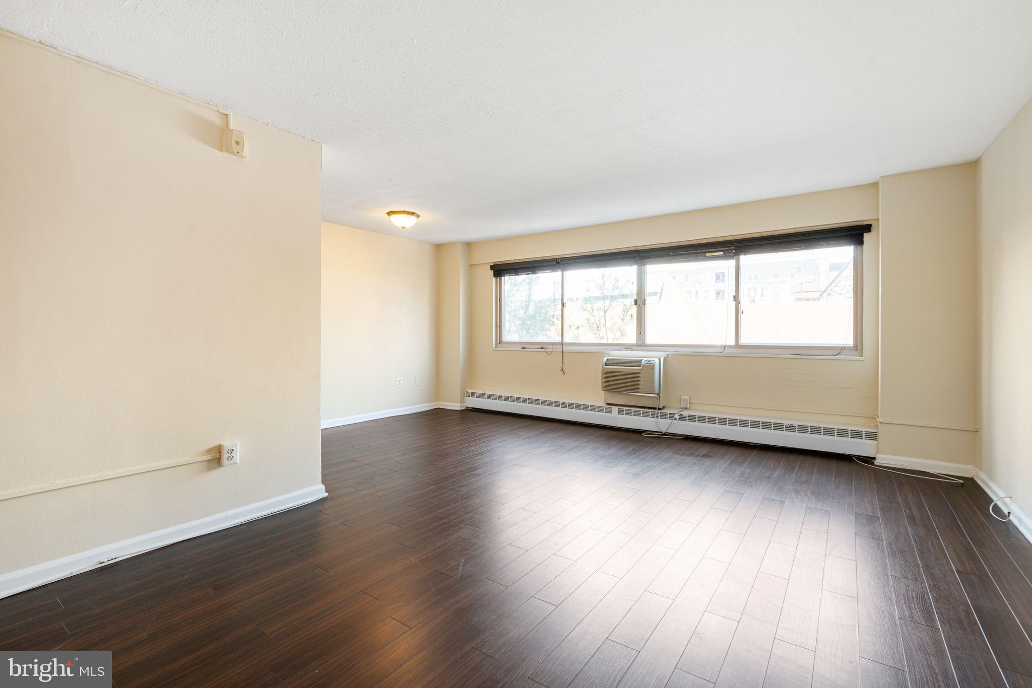 Welcome to Unit 518 at River West Condominiums — a spacious and stylish two-bedroom, one-bath condo located in the heart of Rittenhouse Square. Perched on the 5th floor, this bright and inviting home features gorgeous dark wood floors throughout and large windows that flood the space with natural light. The living room and dining area offer an open, comfortable layout perfect for everyday living or entertaining. The kitchen is efficiently designed and ready for your culinary creativity.
Both bedrooms enjoy beautiful natural light and share the same rich wood flooring. The full bathroom is appointed with a tub/shower combination and a wide vanity mirror with elegant lighting.
River West offers fantastic amenities including a fitness center, concierge, elevator, meeting room, secure entry, and more — all covered by the condo fee. Ideally situated just blocks from Rittenhouse Square, Trader Joe’s, and some of the city’s best shopping and dining, this is Center City living at its finest.