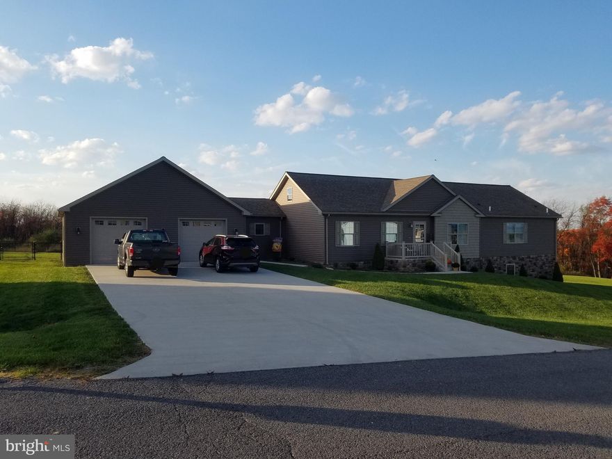 BEAUTIFUL SPACIOUS HOME!!!   Nestled in Harvest Hills this beautiful 3 bed 2 1/2 bath home features a living room, kitchen, dining room with an ELEGANT OPEN FLOOR PLAN accented by recessed lighting, room dividing pillars, and an entertainment wall of built in cherry cabinetry/shelves and a foyer that invites you into it all!!!....LARGE KITCHEN ISLAND with double farmhouse sink and breakfast bar...formal styled dining room with a TRAY CEILING and access to a large roof covered deck/porch! "Mud room" with half bath and PANTRY coming from the garage to the kitchen! Laundry room on main floor!! Primary bedroom with spacious WALK-IN CLOSET and bathroom featuring a WALK-IN TILED SHOWER and HIS & HER SINKS...Lots of storage with a "walk-up walk-in" FULL ATTIC!  And let's not forget about the FULL WALK- OUT BASEMENT (plumbed for bathroom) and TWO CAR GARAGE with concrete driveway and if you love your pets the FENCED-IN backyard!!!  ALSO INCLUDES AN ADDITIONAL LOT for a nice buffer and spacious yard!!!  PRICE REDUCED,  come look at this BEAUTIFUL PROPERTY....