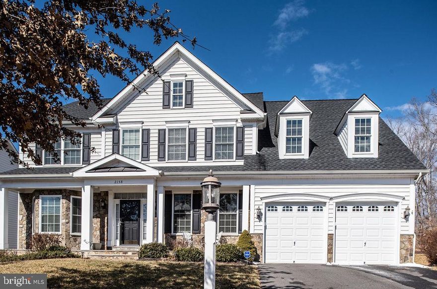 You have arrived! Step inside and fall in love with this grand home.  Walk up on the slate stone front porch to the entry. The 2 level foyer opens to the living room and dining room on either side. Arched entry ways frame both sides. Just over 5700 total square feet of luxury home with a four foot bump out on all levels and sprinkler system in the yard.  The semi open floor plan caters to entertaining on the main level. The wide foyer leads to the eat in kitchen which features lots of granite counter space, breakfast bar a built in desk area with storage, pantry and room for a full table. Gas cooking available.  Gorgeous views to the back yard and access to the 23 x 13 Trex Pro deck with screened in9x9 gazebo and solar caps on the deck posts for nighttime lighting and underdeck storage. A Nightwatcher security light with camera and motion detector keeps watch . Beautiful mill work opens up the family room with fire place for easy entertaining or gatherings. Around the corner is the office with French doors and beautiful powder room.  Hardwood stairs with wrought iron spindles lead up to the bedroom level.  Two bedrooms share a Jack n  Jill bathroom with double sinks; one bedroom has private bathroom. The Primary bedroom suite has a super large sitting room with lots of windows for natural light. Step up into the bedroom area where hardwood flooring continues through the bedroom and large walk in closet. The primary spa bathroom features porcelain flooring,  two separate sinks. extra large shower with bench, separate tub, water closet and linen closet. Granite counters and beautiful gray tile work throughout.  The lower  has 9 ft ceilings a large open recreation area with rough to add a separate kitchen. A full bathroom with tub/shower; 2 bonus rooms and under stair storage. A large utility room complete the space. This beautiful home is located on a cul de sac and backs to trees. Don't miss out on an opportunity to own this premium home!  Powell's Landing has 382 Single Family Homes and 181 Town Homes with a 2,000 sq ft clubhouse, pool, basketball court, tennis court, volleyball court, two playgrounds, pocket parks, two gazebos, and other unique environmental elements add to the community’s charm and unique ambiance. Powell's Landing is conveniently located 25 minutes south of the Beltway, and just a short distance from our Nation's Capitol. Also, the community is located a short distance away from the Prince William National Forest Park, which has camping and beautiful walking trails and is located 20 minutes from the Marine Corps Base, Quantico. With shopping near by at Potomac Mills Mall and Stonebridge at Potomac Town Center which is less than 5 miles away from our community. Powell's Landing is perfectly located for shopping, dining, recreation and some of the best sightseeing in the area has to offer.