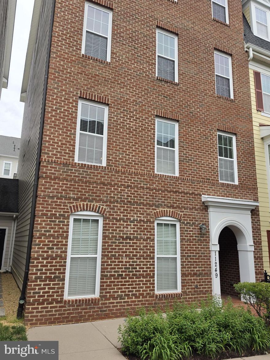 Beautiful End of group 2-bedroom 2 1/2 bath T/H Condo.  One car garage. Just professionally painted and New Carpet installed in Bedrooms and on steps, Hardwoods throughout the remainder. Entry level has a sitting/bonus room and half bath/powder room. Hallway leads to garage. Second level has a great Kitchen with Stainless Appliances and plenty of beautiful cabinetry, Granite Breakfast Bar & Counter Tops with decorative hanging lights. Second level also has living and dining areas.  Custom Blinds throughout. Primary suite with walk in closet and large full bath. Second bedroom with full bath located just outside the door in the main hallway. Close to downtown Maple Lawn, shopping and restaurants. Close to Rt. 29 and 32. Conveniently located near NSA, Hopkins APL & Washington D.C.  Many community amenities for recreational activity including pool, tennis courts, and recreational facility.