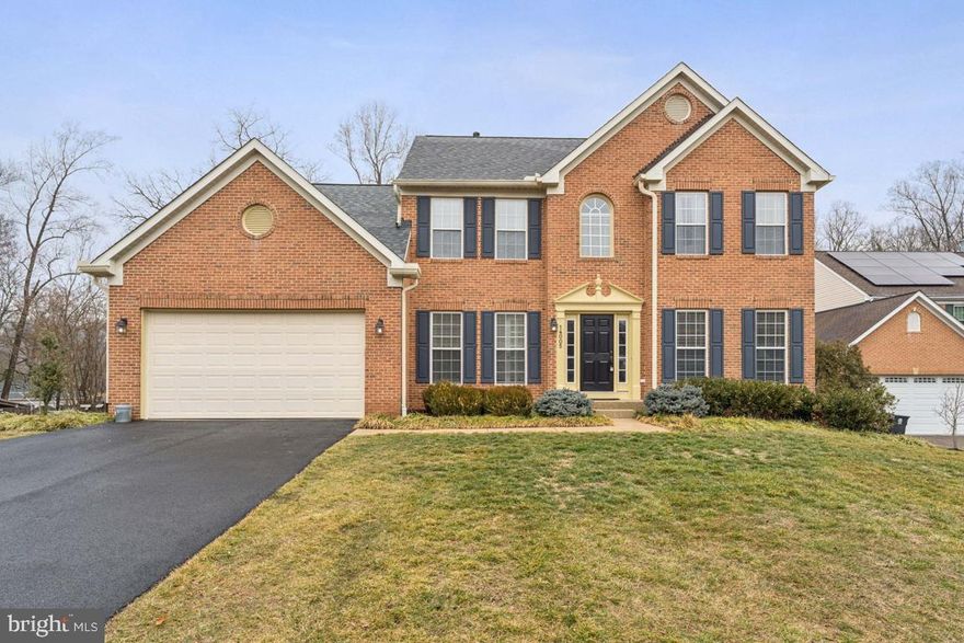 MUST SEE – Absolutely stunning, light & bright, four-bedroom, three full and one-half bath brick front and vinyl siding colonial home with completely finished basement is located on a nice lot with custom landscaping on a quiet street in desirable west Laurel. This beautiful three-level home with approximately 3000 square feet of living space features numerous updates, including fresh paint, new basement carpeting, a new roof and gutter system, new garage doors, newer W/D, a beautiful deck and a fenced backyard. The foyer entry leads to the spacious living and dining rooms, a den/office area with double glass/wood frame doors, a powder room with pedestal sink and garage access. The home then opens up to a beautiful, open, combination family room/kitchen area with cathedral ceilings, a cozy gas fireplace and a perfect family gathering space. Recessed lighting and vinyl, double-pane, tilt-out windows and accent windows provide tons of natural light. French doors open to a huge TREX deck with custom lighting and plenty of room for entertaining, cook-outs and relaxing weekends outside. The spacious kitchen features a large island, white cabinetry with soft-close doors, stainless steel Samsung appliances, a five-burner gas stove with a built-in microwave, a deep, two compartment stainless steel sink with custom fixture and loads of granite countertops and a bonus desk space. A convenient laundry room features a one-year-old GE, full-sized washer/dryer set and extra shelving. The carpeted stairway to the upper level features a primary bedroom with a vaulted ceiling, sitting area, a large walk-in closet with decorative window and a ceiling fan with light kit. The primary bath boasts double-door entry, oversize ceramic tile flooring, a large custom double-sink vanity with chrome fixtures, a jetted tub, a tiled shower stall and separate linen closet. Bedrooms two, three and four are all carpeted with baseboard trim and boast spacious closets, neutral paint and ceiling fans. The hall bathroom has large, ceramic tile flooring, an updated vanity and a tub/shower with ceramic tile surround. The spacious finished lower-level features recessed lighting, brand new wall-to-wall carpeting, a full, updated bathroom and a walkout exit that leads to a wide, fenced yard that backs to woods and protected space. Other special features in the home include gorgeous hardwood plank flooring, large, custom ceramic tile flooring, crown molding, a whole house sprinkler system, new garage door and updated lighting throughout. Located just minutes from major commuter routes, schools, parks, trails, lots of shopping, restaurants and more - this beautiful and rarely available Wyndham Woods home has it ALL!