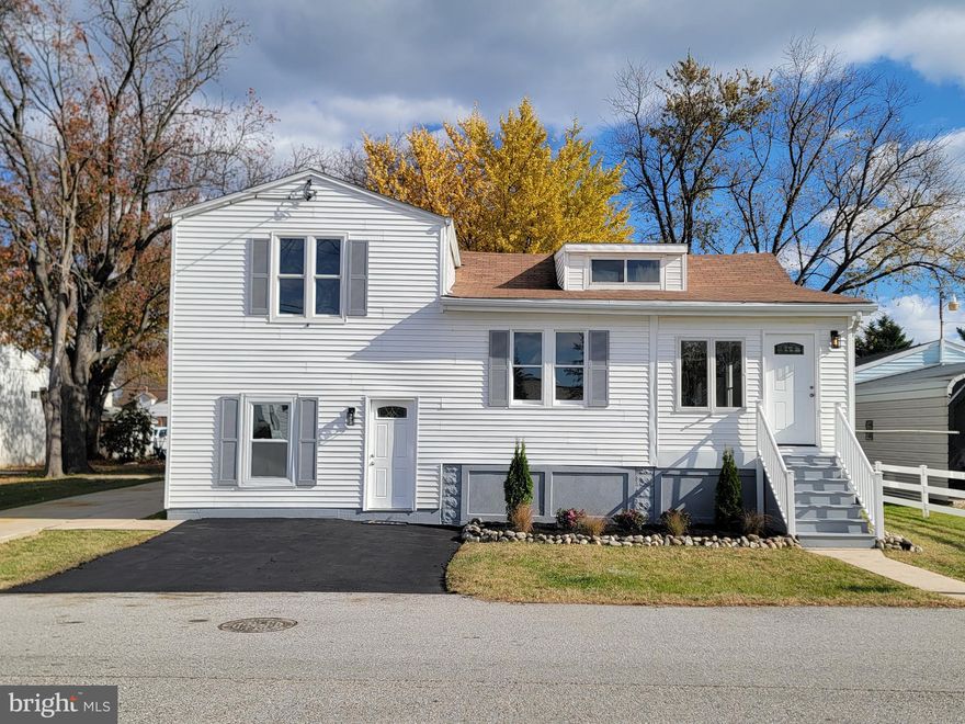 Welcome to this beautifully renovated home in sought-after Sparrows Point. This versatile property is perfect for the smart buyer, offering 4 bedrooms and 2 full bathrooms along with a bonus attached 1-bedroom, 1 bathroom apartment with full kitchen, for a total of 5 bedrooms and 3 bathrooms—ideal for an in-law suite, guest space, home business, or rental income. Or, use for your family as a sweet game room/ fun room. 
 As you walk in the front door, this level consists of an open concept living space with living room and dining area which leads into the kitchen.The brand new kitchen boasts lots of storage in the sterling gray shaker cabinets and brand new silver fantasy quartzite countertops with peninsula. All new stainless steel kitchen appliances. Off the kitchen you will find a generous sized laundry room. This level also has 2 bedrooms and a a full bath with jacuzzi tub. On the second level there are two large bedrooms, another bathroom, and a large walk-in closet. The other side of the house has a one bedroom, 1 bathroom apartment/ in-law suite. This suite has the same cabinets and countertops as the other side of the home. There is a large living area, bedroom, and bathroom.
A long concrete driveway leads to the large 20 ft x 26 ft metal pole building detached garage with concrete slab and electric. The driveway has room for several cars, your camper, trailer, boat, etc. There is a nice size yard with several mature trees.