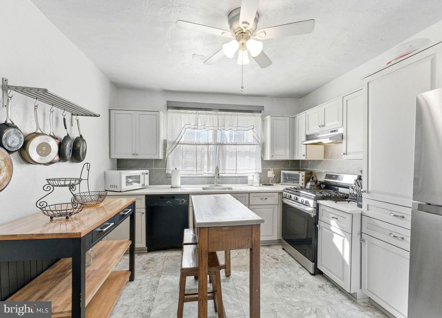Pride of ownership shines in this beautiful East Mt. Airy rowhome. Welcome to 7826 Michener Ave, a residence that perfectly balances classic comfort with modern upgrades. Step inside to a spacious, light-filled living and dining area featuring durable laminate flooring that creates a warm, seamless flow throughout the main level. The heart of the home is the fully updated kitchen, boasting soft-close shaker cabinetry, stylish quartz countertops, and stainless steel appliances. The versatile moveable center island provides the perfect spot for morning coffee, meal prep, or casual entertaining. Upstairs, you’ll find three generously sized bedrooms and a 4-piece hallway bath. The lower level adds incredible value with a convenient powder room and a sizeable basement. Whether you envision a cozy family room, a home gym, or premier storage, this space is a blank canvas. With an attached garage for easy parking and a low-maintenance front patio for outdoor relaxation, this turn-key home offers total peace of mind with well-maintained major systems. Schedule your private tour today! ... Sale is contingent on sellers finding suitable housing.