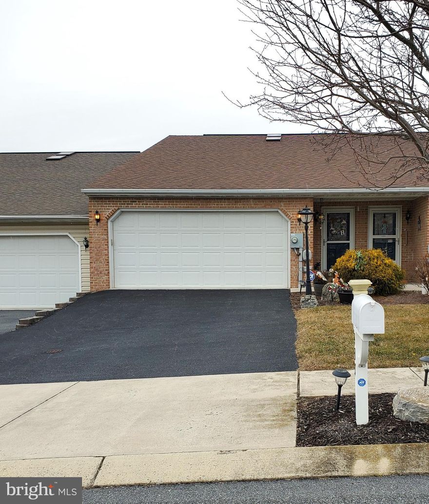One-Level Living and move-in ready!  Brick rancher-style townhome has 2 bedrooms, 2 full bathrooms and 2-car garage.     Open floor plan with cathedral ceilings and skylights.  Kitchen has pantry, tile backsplash and breakfast bar.   Primary bedroom walks out to screened-in deck and backyard.  Primary bath has walk-in shower.  Conveniently located just minutes from town.