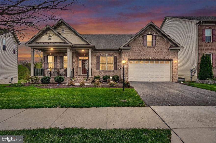 This stunning luxury ranch-style home located in the highly sought-after Landsdale community offers the very best in single-level living plus an expansive finished lower-level providing plenty of versatile space. Featuring 9-foot ceilings throughout, the home welcomes you with a gorgeous octagonal foyer, elegant crown moldings, and rich hardwood floors that set the tone for refined comfort.

The gourmet kitchen is a true centerpiece, boasting a gas cooktop, double wall ovens, granite countertops, rich cabinetry, and a large island ideal for entertaining. It opens seamlessly into a light-filled, spacious living area with a cozy gas fireplace and direct access to a large composite deck.

The primary suite is a private retreat complete with tray ceiling, a generous walk-in closet and a luxurious en-suite bath featuring a soaking tub, double vanities, and a walk-in shower.  A lovely formal dining room, two additional bedrooms, a full hall bath with tub, comfortable office/den, a mud room leading to an attached two car garage and a convenient laundry room round out the main floor.

A huge, finished walk-out lower level provides additional living space including a large recreation area, a fourth bedroom with walk-in closet, a full bath, a finished storage room, and a huge utility/storage area.

Outdoor living is just as impressive, with a spacious composite deck overlooking a beautifully landscaped lot, an attractive paver patio, and a welcoming covered front porch all perfect for relaxing or entertaining. 

The Landsdale community provides excellent schools, beautiful resort style community pool, meeting rooms, multiple playgrounds, ball courts, walking paths and scenic ponds. Convenient to I-270, I-70, and amenities offered in thriving Urbana and Historic Frederick. 

Elegant ranchers like this one do not come on market often so don't miss out! Virtual staging used in some photos.