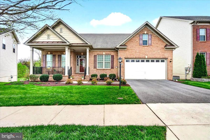 This stunning luxury ranch-style home located in the highly sought-after Landsdale community offers the very best in single-level living. Featuring 9-foot ceilings throughout, the home welcomes you with a gorgeous octagonal foyer, elegant crown moldings, and rich hardwood floors that set the tone for refined comfort.

The gourmet kitchen is a true centerpiece, boasting a gas cooktop, double wall ovens, granite countertops, rich cabinetry, and an expansive island ideal for entertaining. It opens seamlessly into a light-filled, spacious living area with a cozy gas fireplace and direct access to a large composite deck.

The primary suite is a private retreat complete with tray ceiling, a generous walk-in closet and a luxurious en-suite bath featuring a soaking tub, double vanities, and a walk-in shower.  A lovely formal dining room, two additional bedrooms, a full hall bath with tub, comfortable office/den, a mud room leading to an attached two car garage and a convenient laundry room round out the main floor.

A huge, finished walk-out lower level provides additional living space including a large recreation area, a fourth bedroom with walk-in closet, a full bath, a finished storage room, and a huge utility/storage area.

Outdoor living is just as impressive, with a spacious composite deck overlooking a beautifully landscaped lot, an attractive paver patio, and a welcoming covered front porch all perfect for relaxing or entertaining. 

The Landsdale community provides excellent schools, beautiful resort style community pool, meeting rooms, multiple playgrounds, ball courts, walking paths and scenic ponds. Convenient to I-270, I-70, and amenities offered in thriving Urbana and Historic Frederick. 

Elegant ranchers like this one do not come on market often so don't miss out! Virtual staging used in some photos.