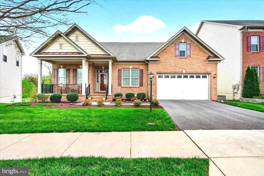 This stunning luxury ranch-style home located in the highly sought-after Landsdale community offers the very best in single-level living plus an expansive finished lower-level providing plenty of versatile space. Featuring 9-foot ceilings throughout, the home welcomes you with a gorgeous octagonal foyer, elegant crown moldings, and rich hardwood floors that set the tone for refined comfort.

The gourmet kitchen is a true centerpiece, boasting a gas cooktop, double wall ovens, granite countertops, rich cabinetry, and a large island ideal for entertaining. It opens seamlessly into a light-filled, spacious living area with a cozy gas fireplace and direct access to a large composite deck.

The primary suite is a private retreat complete with tray ceiling, a generous walk-in closet and a luxurious en-suite bath featuring a soaking tub, double vanities, and a walk-in shower.  A lovely formal dining room, two additional bedrooms, a full hall bath with tub, comfortable office/den, a mud room leading to an attached two car garage and a convenient laundry room round out the main floor.

A huge, finished walk-out lower level provides additional living space including a large recreation area, a fourth bedroom with walk-in closet, a full bath, a finished storage room, and a huge utility/storage area.

Outdoor living is just as impressive, with a spacious composite deck overlooking a beautifully landscaped lot, an attractive paver patio, and a welcoming covered front porch all perfect for relaxing or entertaining. 

The Landsdale community provides excellent schools, beautiful resort style community pool, meeting rooms, multiple playgrounds, ball courts, walking paths and scenic ponds. Convenient to I-270, I-70, and amenities offered in thriving Urbana and Historic Frederick. 

Elegant ranchers like this one do not come on market often so don't miss out! Virtual staging used in some photos.