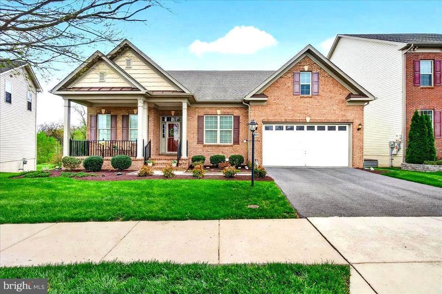 This stunning luxury ranch-style home located in the highly sought-after Landsdale community offers the very best in single-level living. Featuring 9-foot ceilings throughout, the home welcomes you with a gorgeous octagonal foyer, elegant crown moldings, and rich hardwood floors that set the tone for refined comfort.

The gourmet kitchen is a true centerpiece, boasting a gas cooktop, double wall ovens, granite countertops, rich cabinetry, and an expansive island ideal for entertaining. It opens seamlessly into a light-filled, spacious living area with a cozy gas fireplace and direct access to a large composite deck.

The primary suite is a private retreat complete with tray ceiling, a generous walk-in closet and a luxurious en-suite bath featuring a soaking tub, double vanities, and a walk-in shower.  A lovely formal dining room, two additional bedrooms, a full hall bath with tub, comfortable office/den, a mud room leading to an attached two car garage and a convenient laundry room round out the main floor.

A huge, finished walk-out lower level provides additional living space including a large recreation area, a fourth bedroom with walk-in closet, a full bath, a finished storage room, and a huge utility/storage area.

Outdoor living is just as impressive, with a spacious composite deck overlooking a beautifully landscaped lot, an attractive paver patio, and a welcoming covered front porch all perfect for relaxing or entertaining. 

The Landsdale community provides excellent schools, beautiful resort style community pool, meeting rooms, multiple playgrounds, ball courts, walking paths and scenic ponds. Convenient to I-270, I-70, and amenities offered in thriving Urbana and Historic Frederick. 

Elegant ranchers like this one do not come on market often so don't miss out! Virtual staging used in some photos.